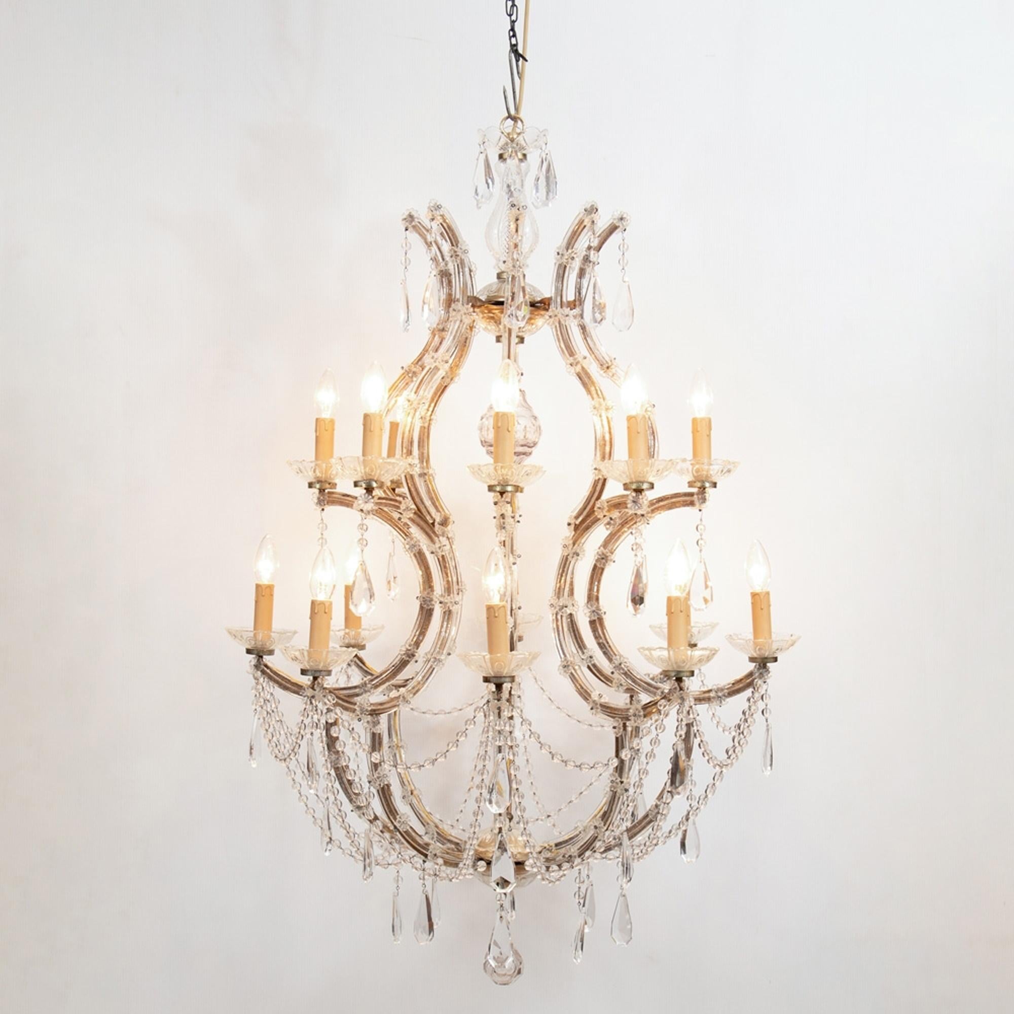 A large 12 branch, two-tier birdcage Maria Theresa chandelier, circa 1940-1950, French. The chandelier has been completely rewired to British Standard and professionally cleaned.