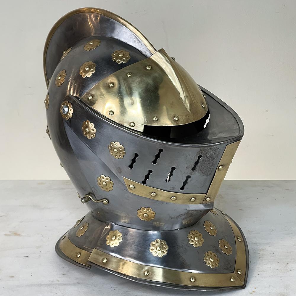 Vintage French Medieval Knight's Helmet in Brass is a marvelous recreation of a period artifact. Hand-crafted by an obviously skilled artisan who clearly studied an original extensively, it was fashioned by hand in brass and nickel-plated brass to a