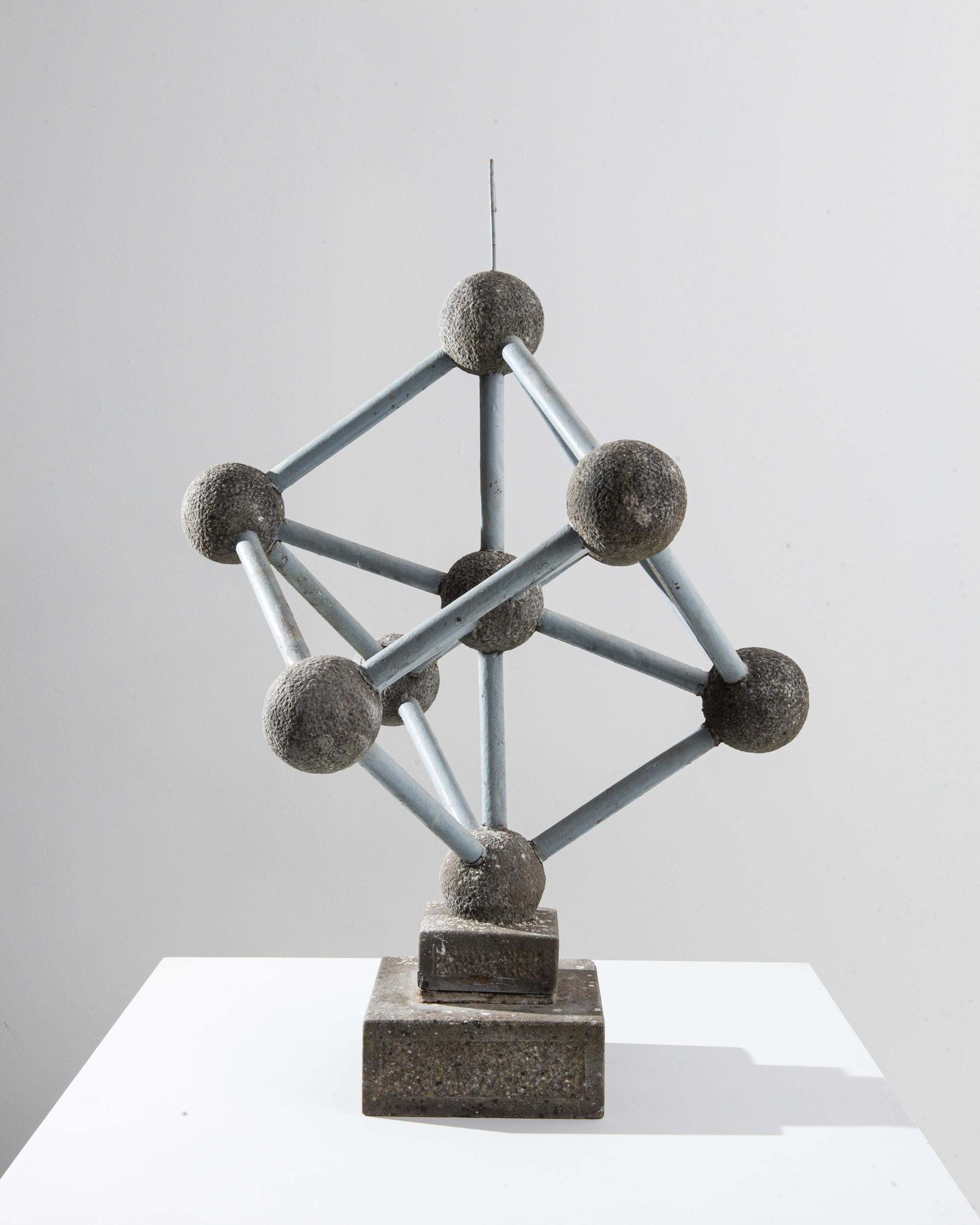Graphic and monumental, this vintage sculpture depicting the structure of the iron molecule, also a notable Belgian landmark, possesses an austere beauty and a poignant resonance. Made in Francein the 20th Century, the spherical electrons are made