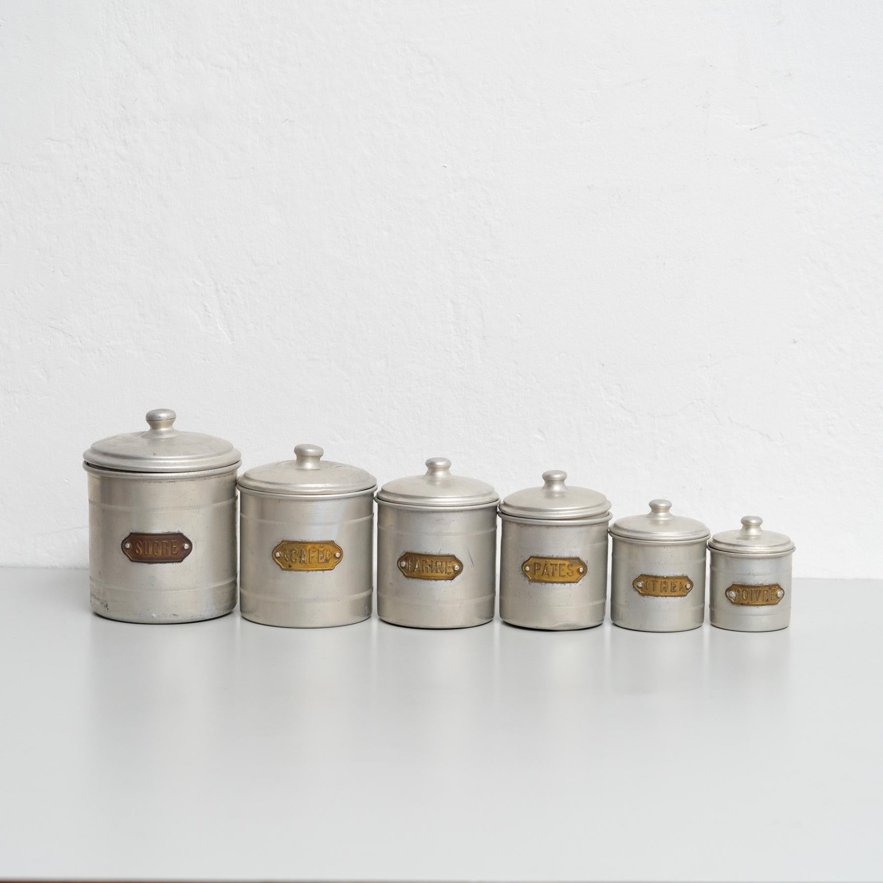 This exquisite set of metal pots, originating from France in the early 20th century, is a true collector’s treasure. Each pot is meticulously designed to store essentials like coffee, pepper, sugar, and other pantry staples. The set showcases the