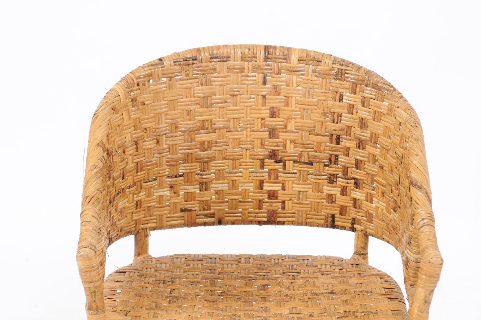 A pair of vintage French woven rattan and bamboo chairs from the midcentury period, with a subtle Chinoiserie inspiration. We have two pairs available, priced and sold per pair. We’re obsessed with all things basket weave, rattan and bamboo, and