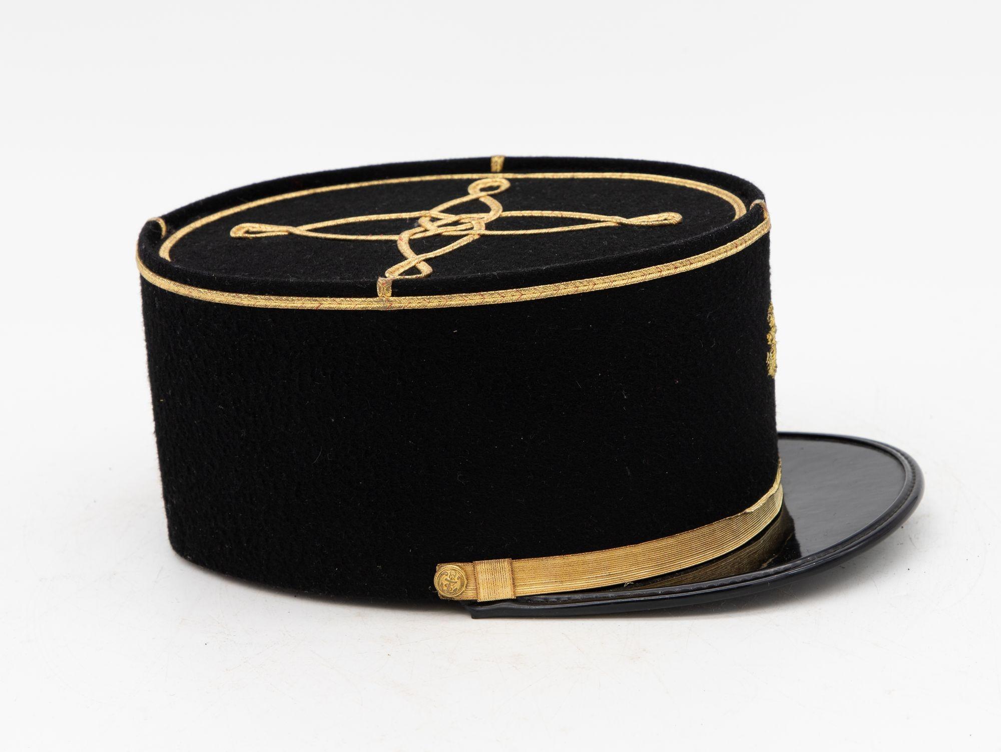 A rare French Military Academy Officer's hat or cap from the 1970s. These special and unique hats are part of the uniform of students studying to become officers in the French Military. This cap features a black leather brim on black felt with a