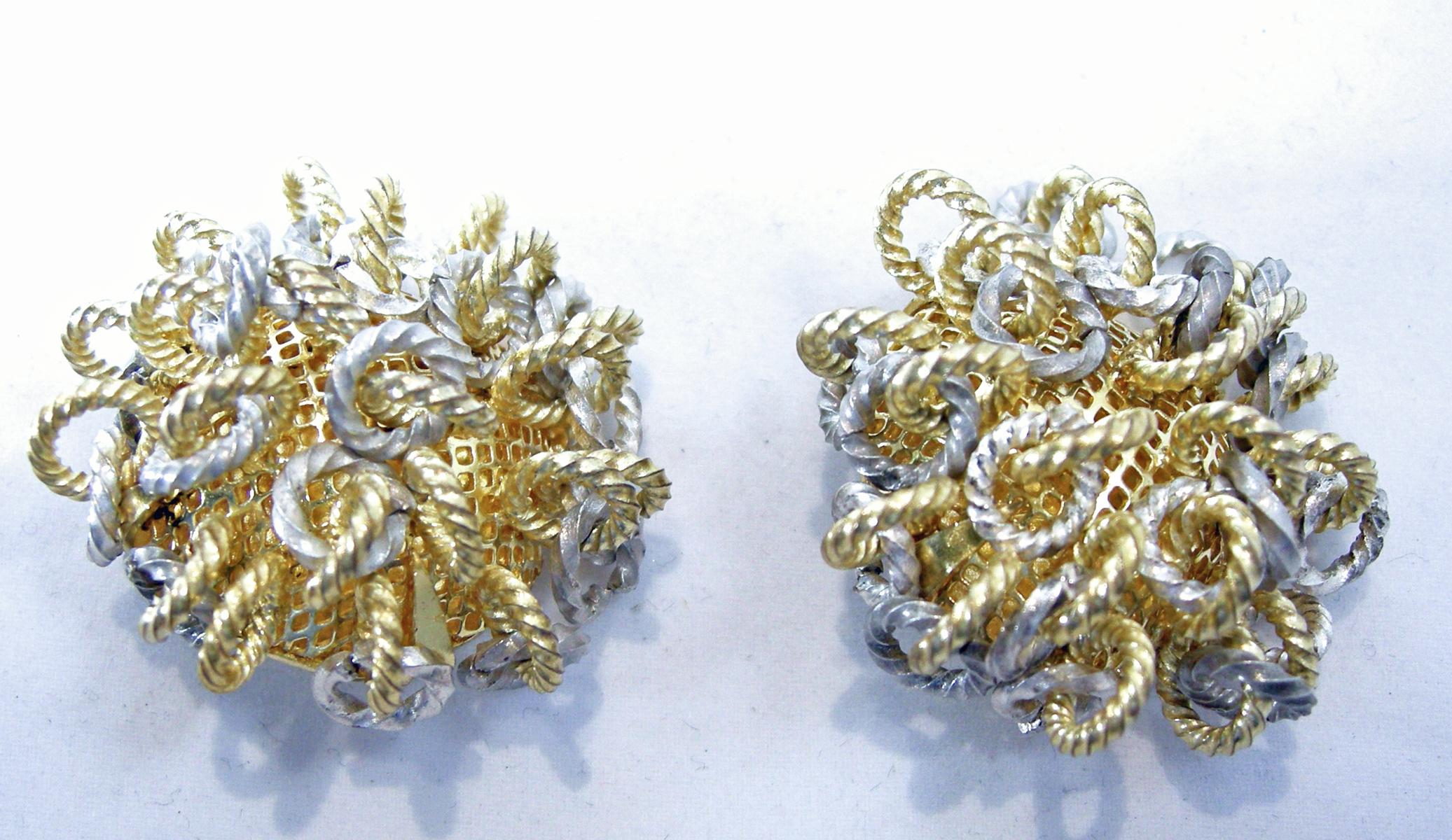 These vintage French earrings have twisted silver tone loops dangling from a gold tone setting.  In excellent condition, these clip earrings measure 1-1/2” in diameter/wide.