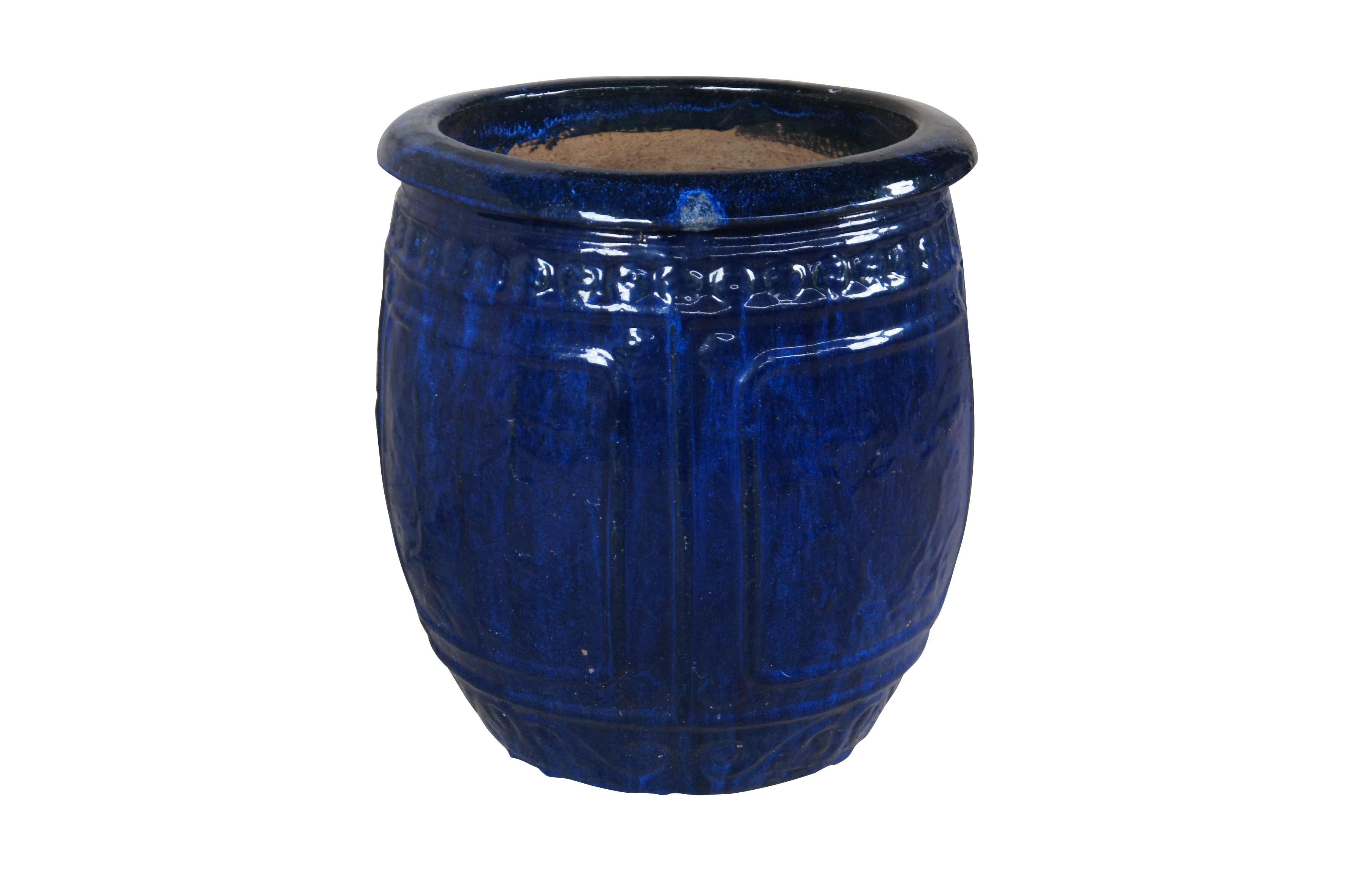 Vintage French clay fired bulbous pot in blue glaze paneling and artistic detail.  2 Drip holes at the base.

DIMENSIONS
17.5