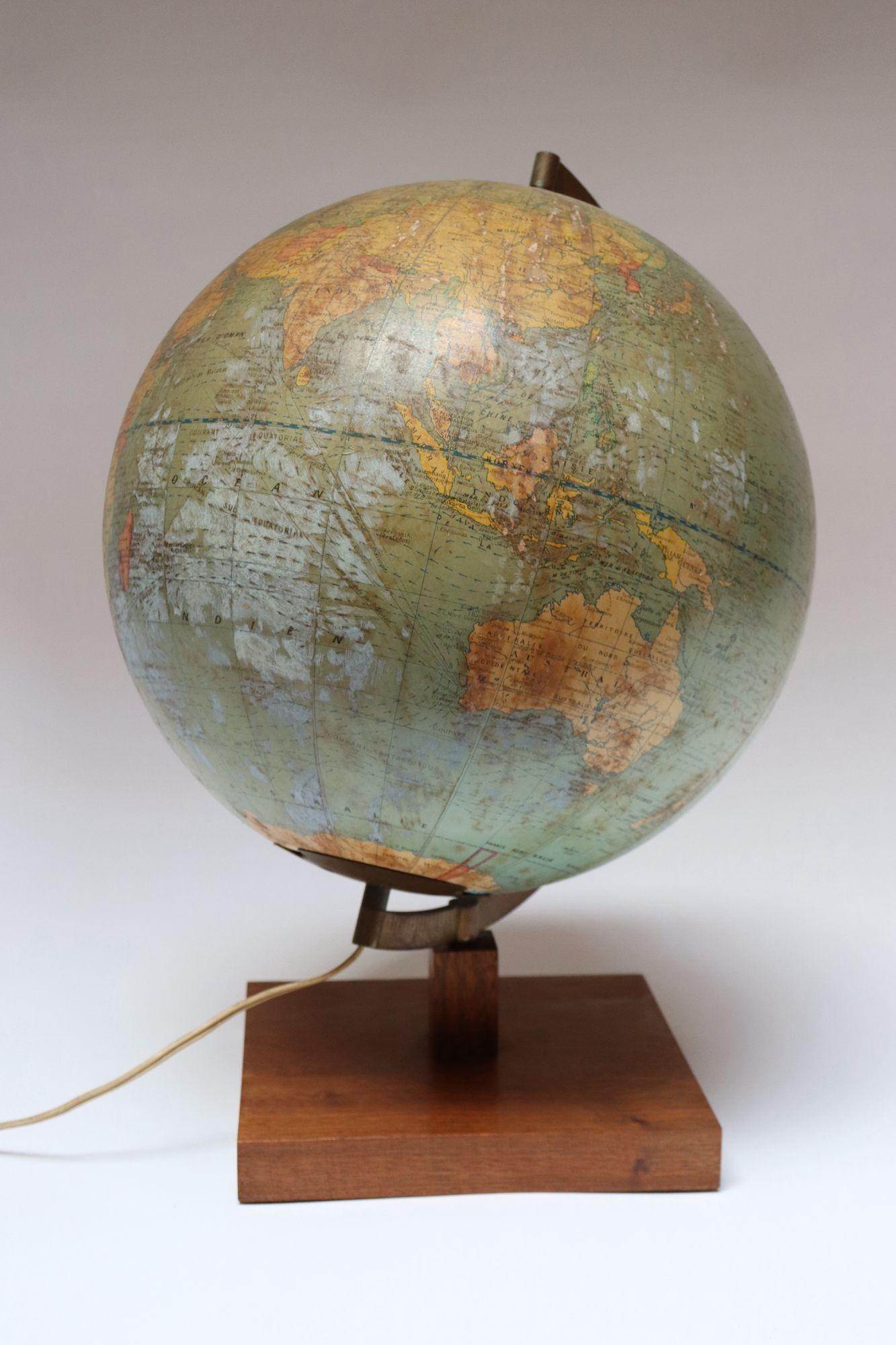 Girard et Barrère illuminated terrestrial glass globe illustrating major shipping routes, ca. 1968, France - Rhodesia and Congo (pre-Zaire) present - Bangladesh not present.
Composed of paper gores over glass, supported by a walnut base and