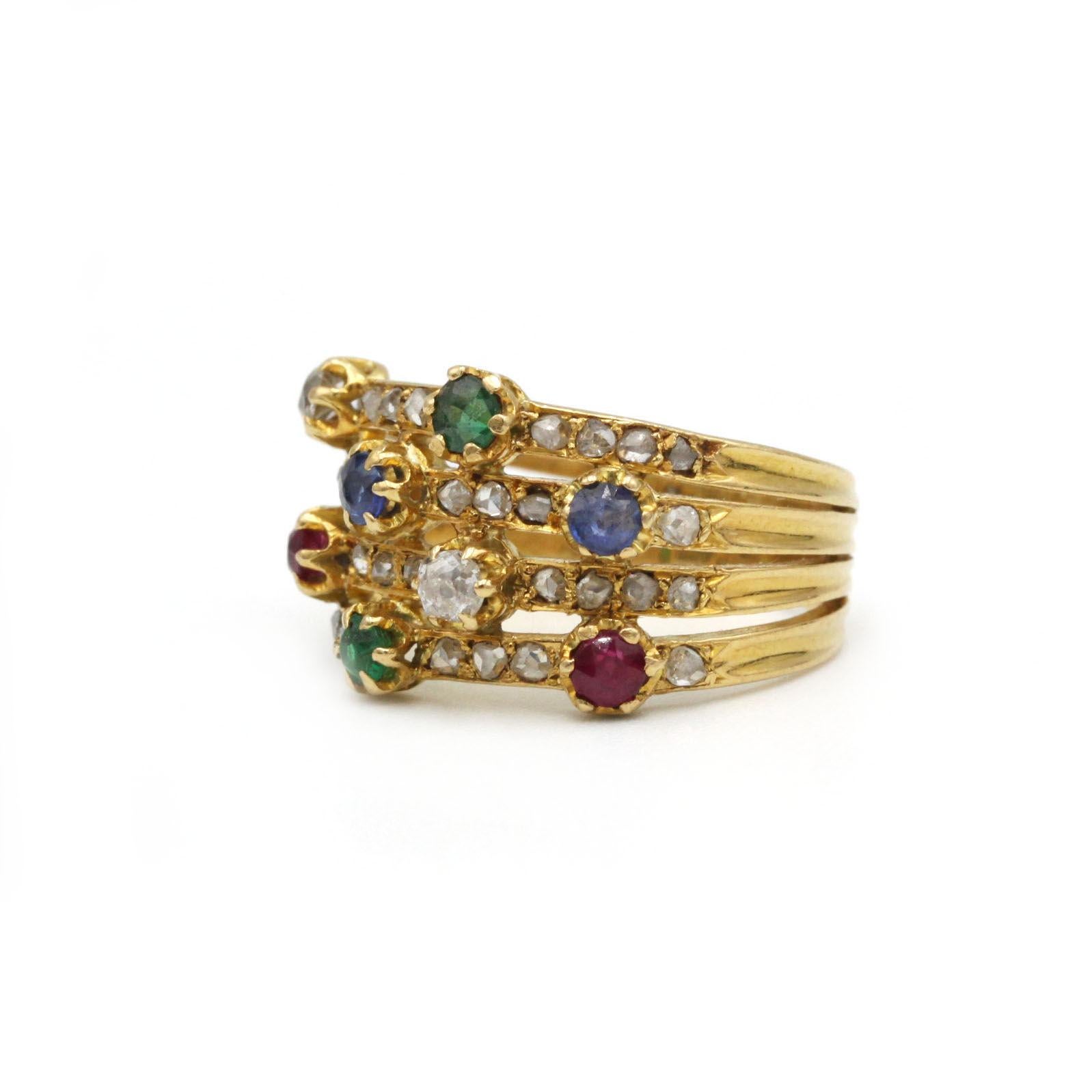 This exceptional vintage French ring is crafted in solid 18k yellow gold and adorned with an elegant array of precious gemstones. The wide, articulated band is set with 2 brilliant-cut diamonds (approx. 0.30 ct total), 2 sapphires, 2 rubies, and 2