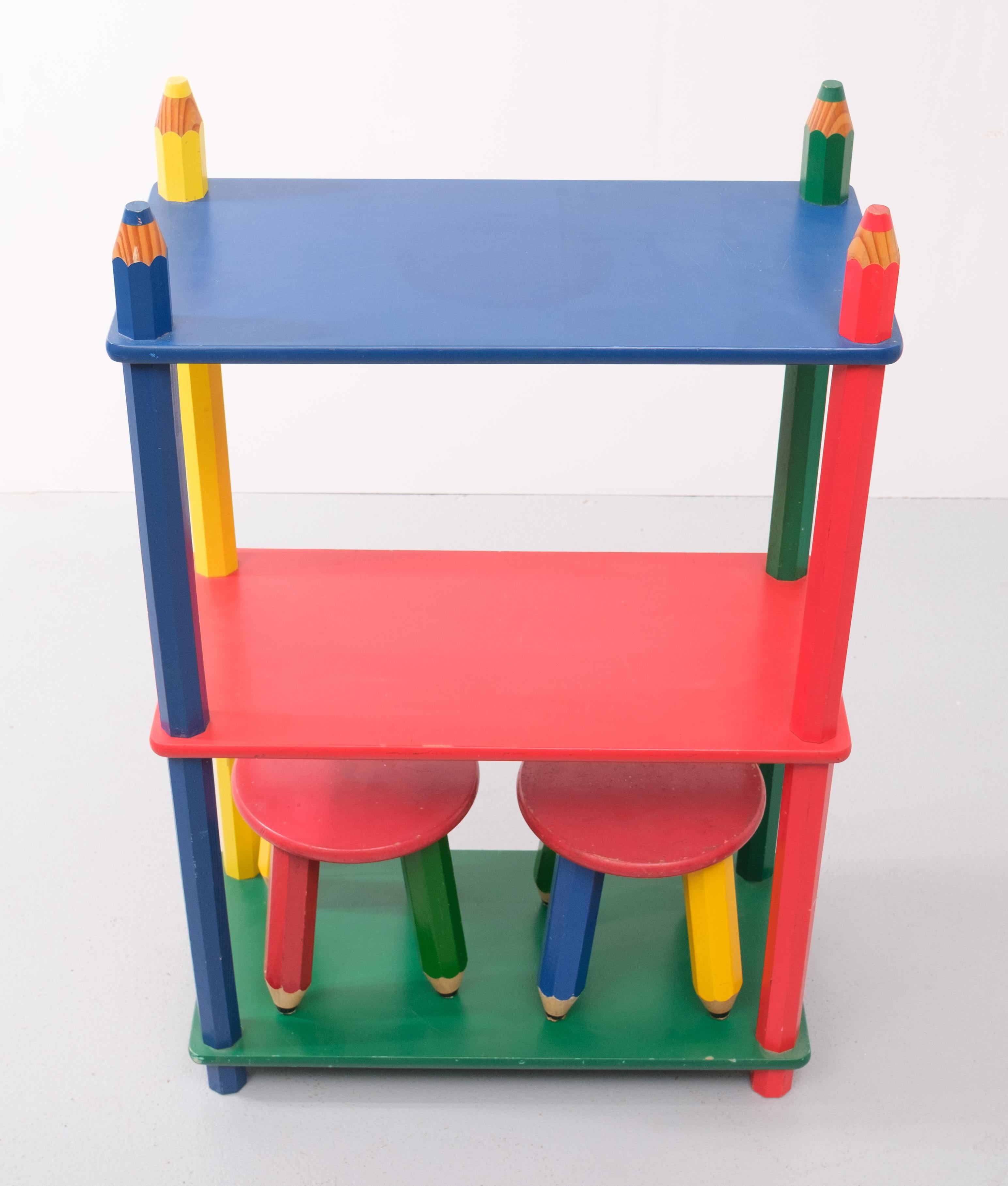 Fantastic Postmodern shelving unit in the design of oversized pencils and 2 little stools 
Attributed to Pierre Sala, France, 1980s Great strong primary colors
There are some age related marks please check the photographs for this.
 Stools Height