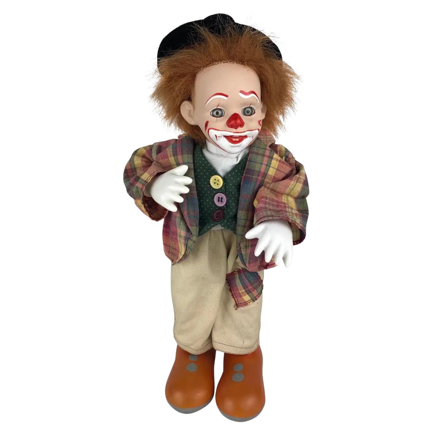 Bambola clown musicale francese d
epoca, testa e mani in porcellana, anni 
50 in vendita