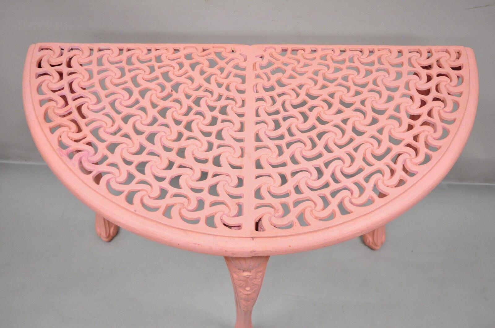 Vintage French Neoclassical style cast aluminum pink demilune console table. Item features pierced decorated top, pink painted finish, cast aluminum construction, very nice vintage item, great style and form. Circa mid-20th century.
Measurements:
