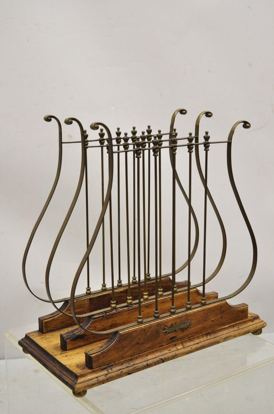 Vintage French neoclassical style Italian brass Lyre Harp magazine rack. Item features brass triple harp dividers, distressed wood base with antiqued finish, brass ball form feet, very nice vintage item, stamped 