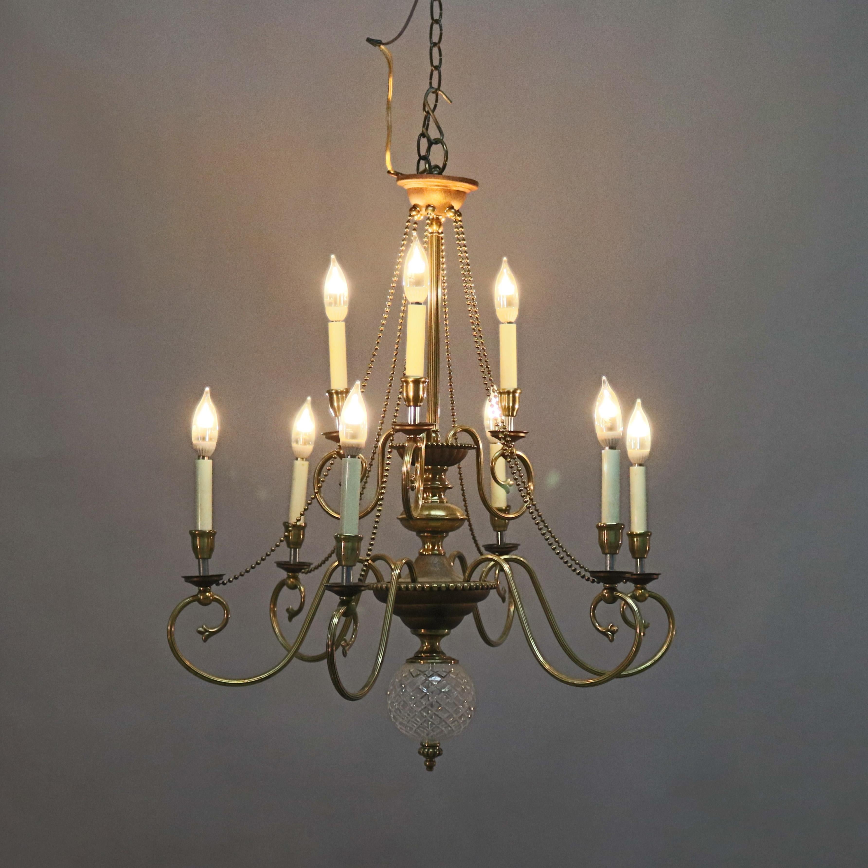 Cast Vintage French Nine-Light Tiered Brass and Crystal Chandelier, 20th Century For Sale