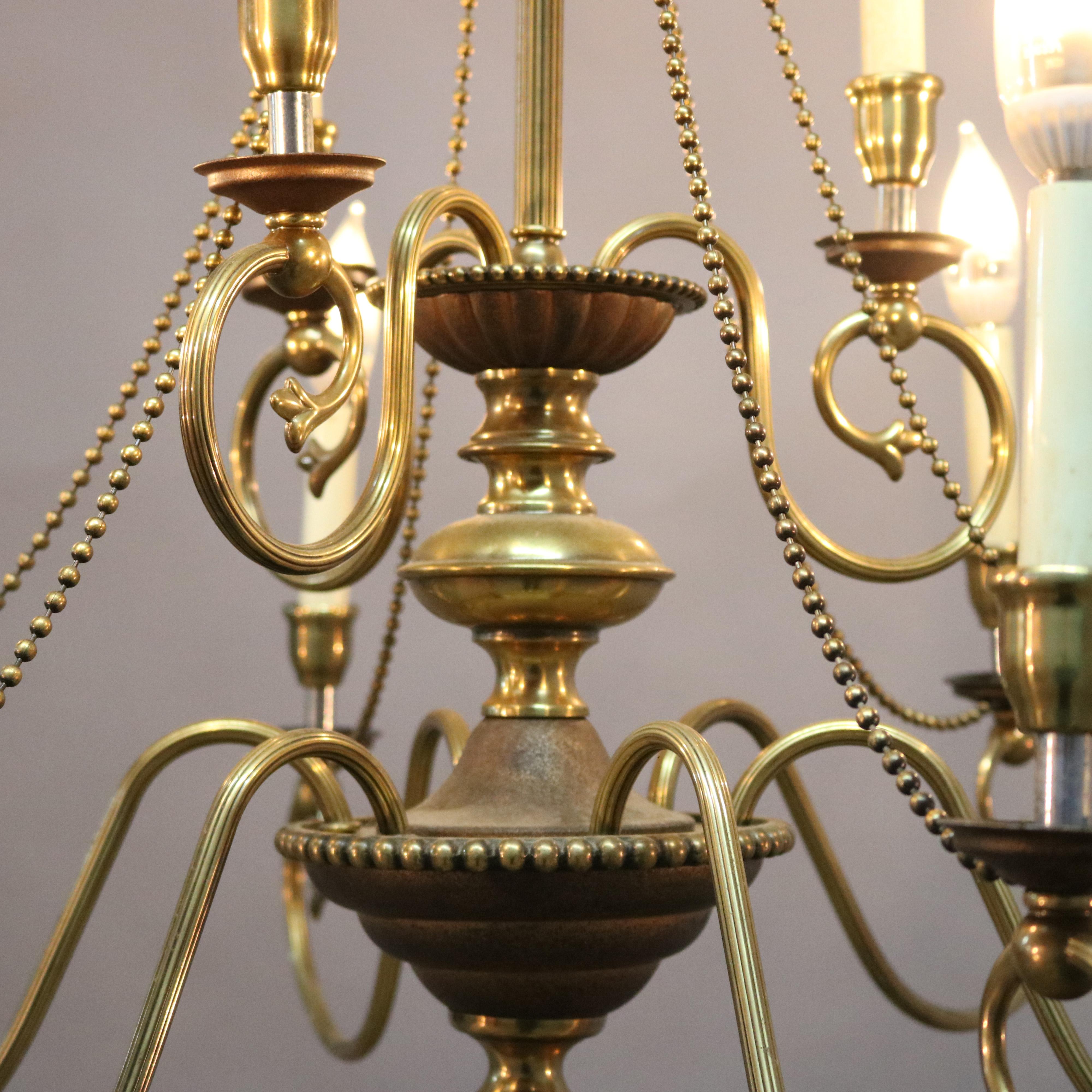 Glass Vintage French Nine-Light Tiered Brass and Crystal Chandelier, 20th Century For Sale