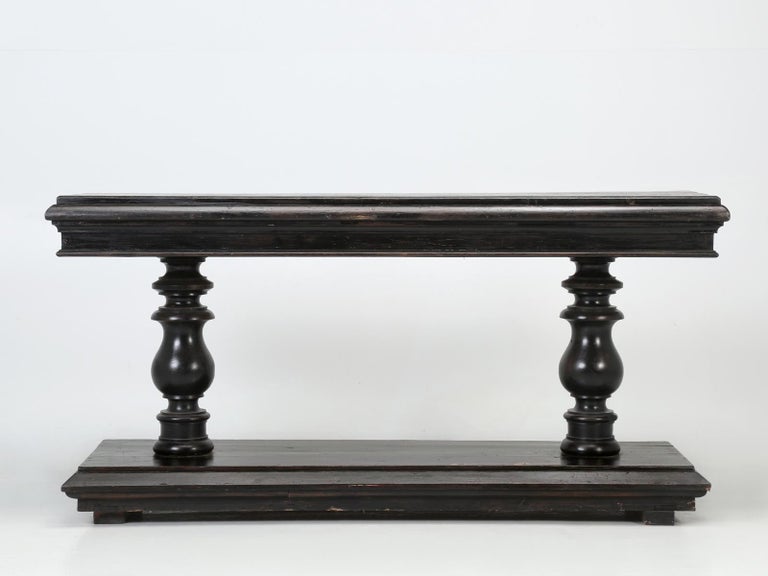 Vintage French console table in old black paint, that we believe may have been used as a store fitting. The painted black French console table, is being offered in the original paint, although if you would like it repainted, our Old Plank finishing