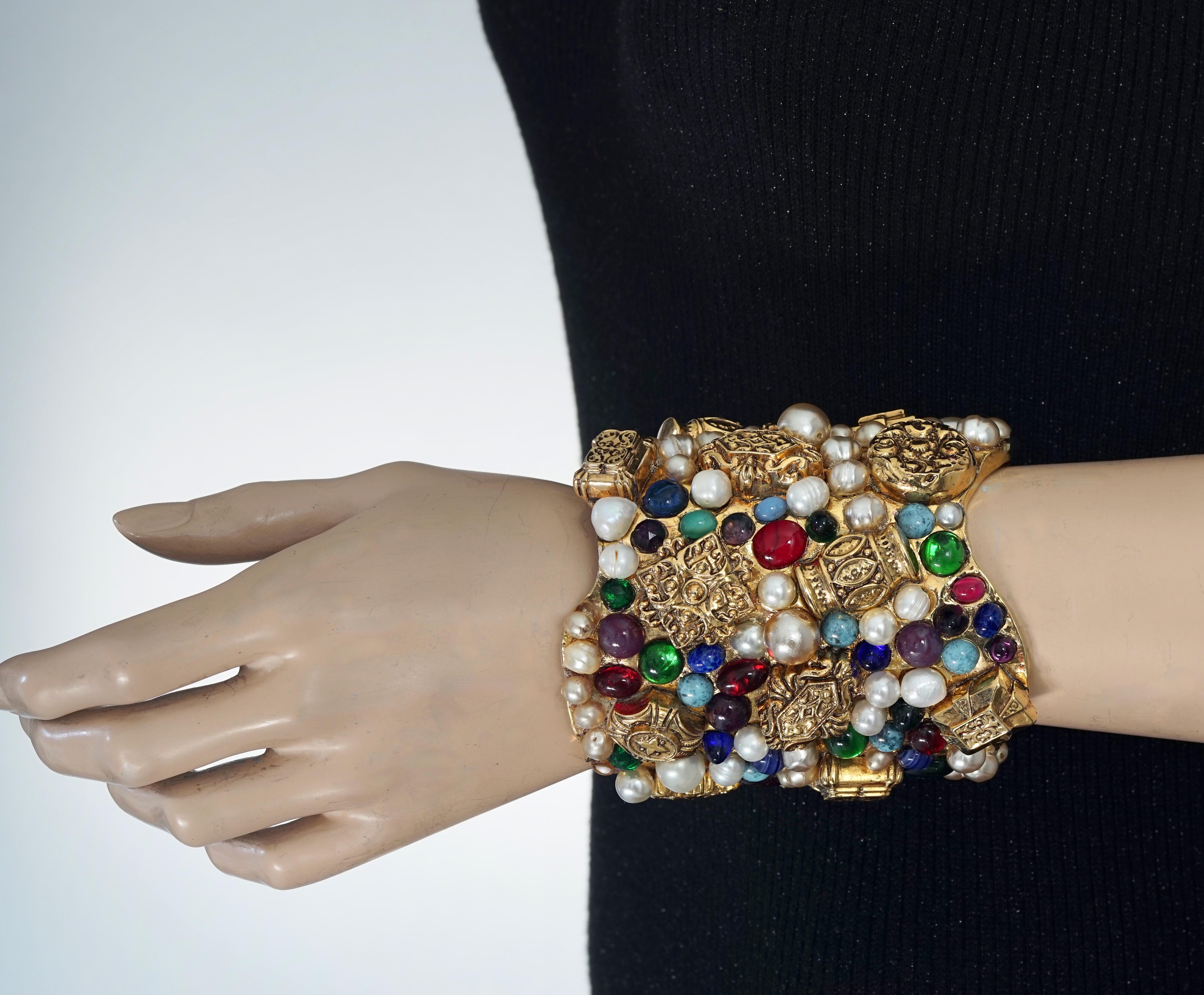 Vintage French Opulent Jewelled Cabochon Pearls Wide Cuff Bracelet

Measurements:
Height: 3.94 inches (10 cm)
Wearable Length: 6.69 inches (17 cm) includes opening

Features:
- Opulent wide, textured resin cuff studded with colourful cabochons and