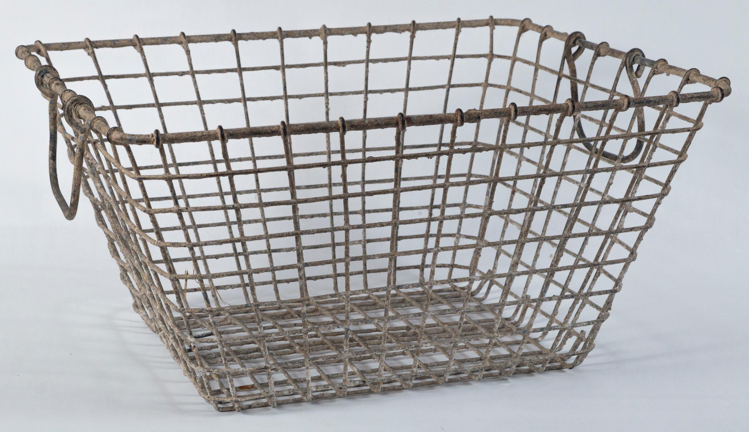 Vintage French oyster baskets - Set of two, 20th century. Used by French oyster farmers at low tide for harvest. Aged patina.