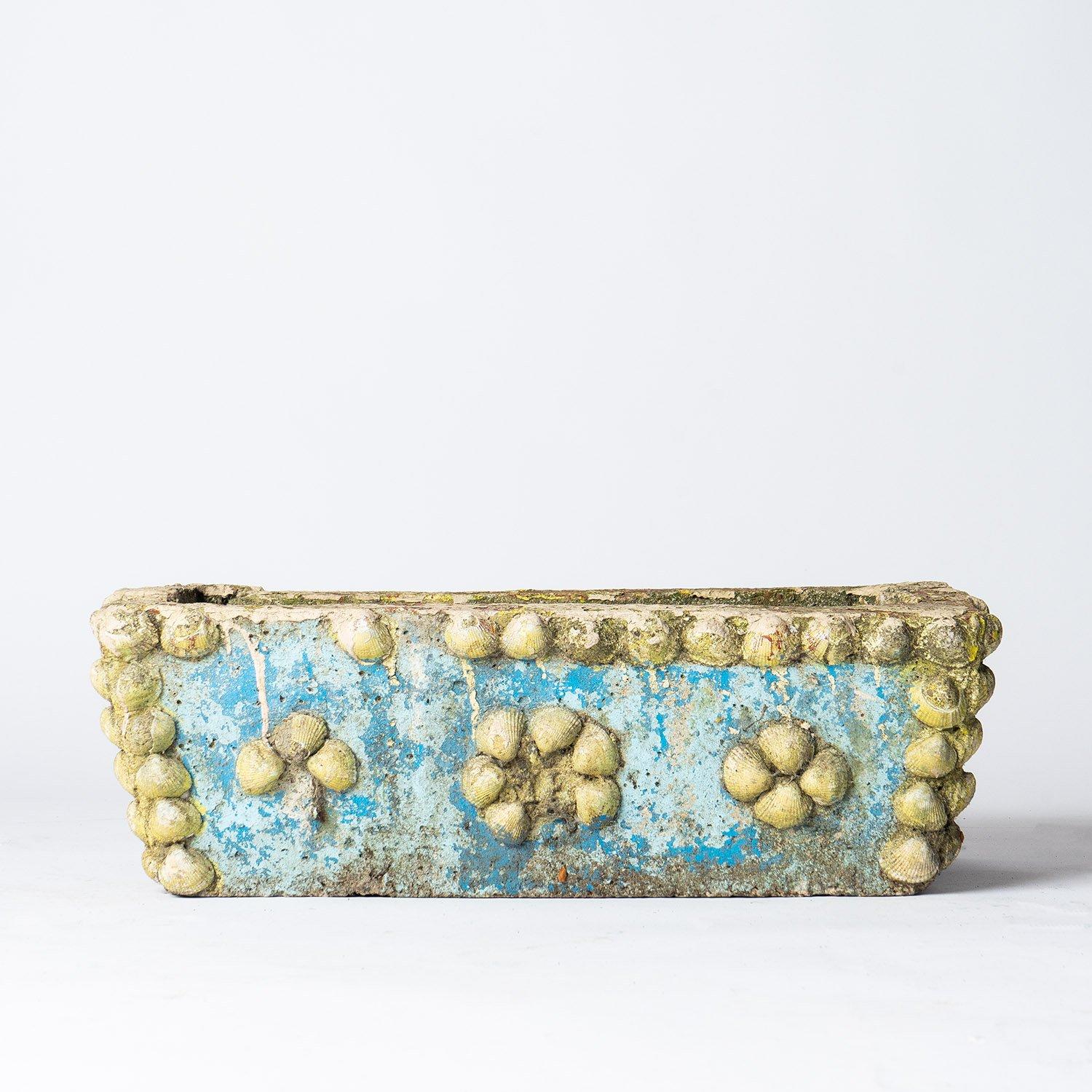 Vintage Hand Decorated Reconstituted Stone Plant Pot

A thick heavy planter in the form of a trough with remnants of original paint and applied clam shell decoration.

Originally made to be used outside but could also be used in an interior