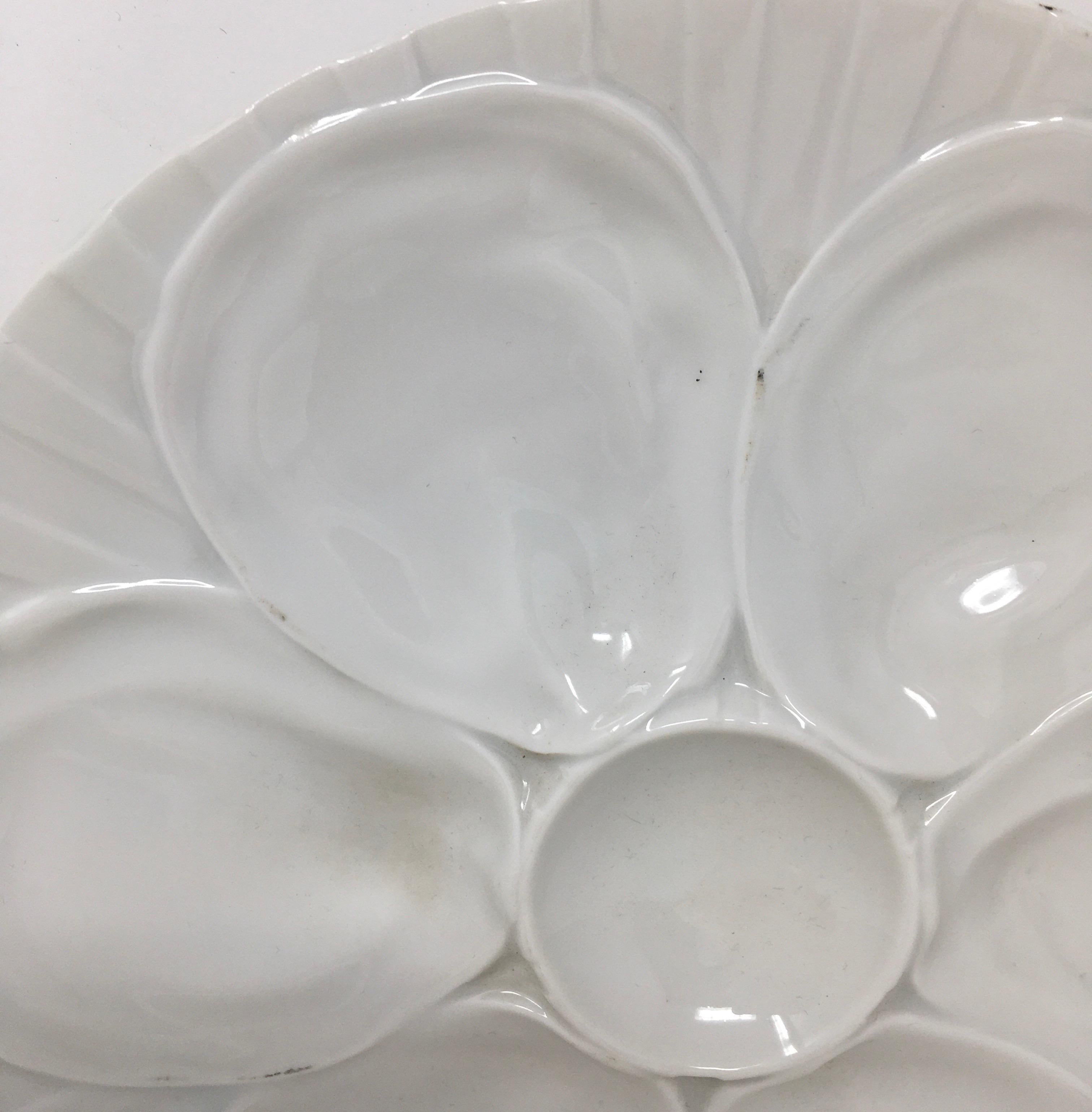 Beautiful white Pillivuyt oyster plate manufactured with six compartments for oysters and a central one for the lemon or sauce. The underside is hallmarked 