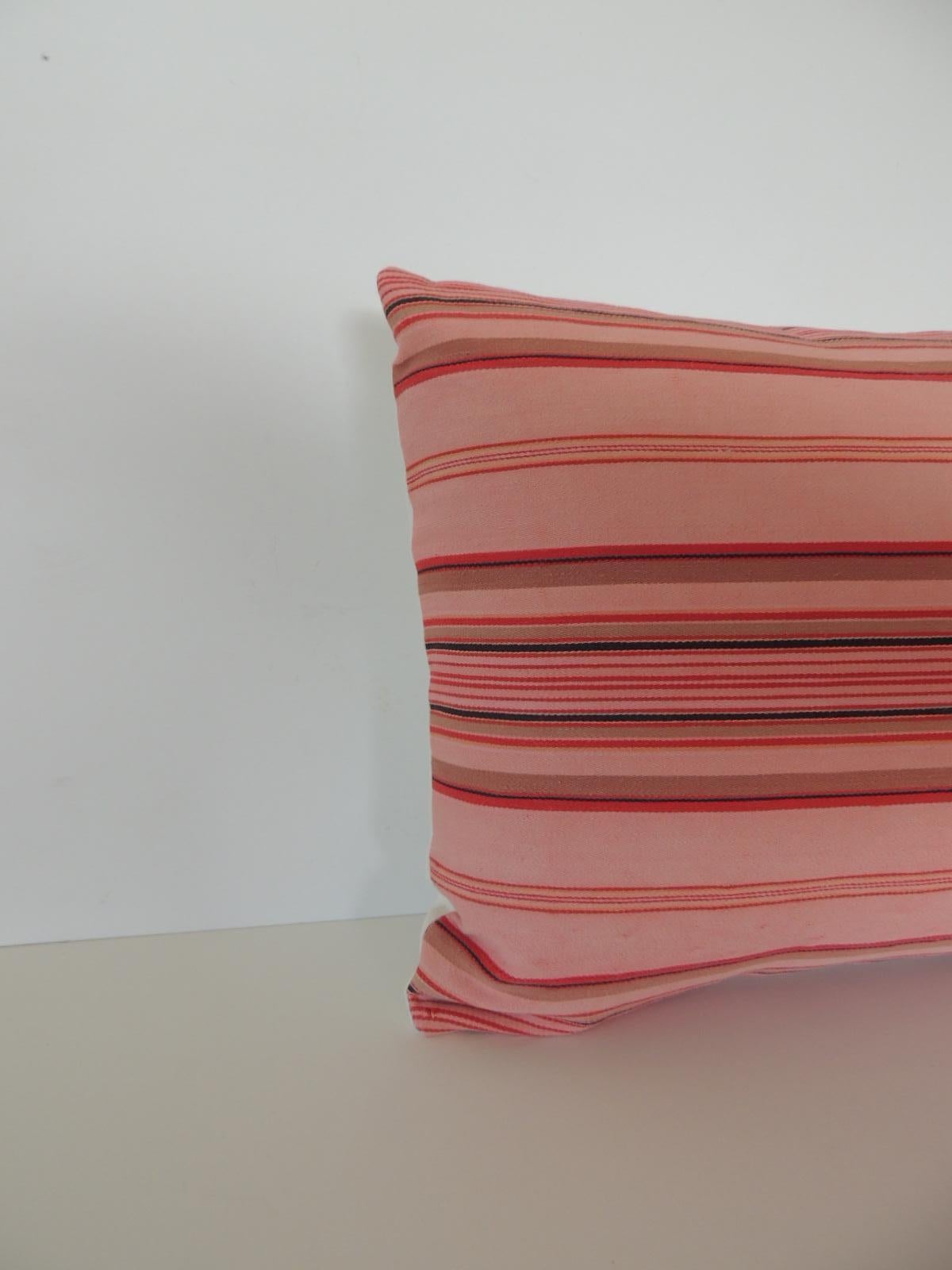 Vintage French pink and red stripes lumbar decorative pillow
French provincial linen ticking stripes lumbar decorative pillow in shades of light pink, dark pink, red, taupe, tan and natural with a natural linen backing. French provincial refers to