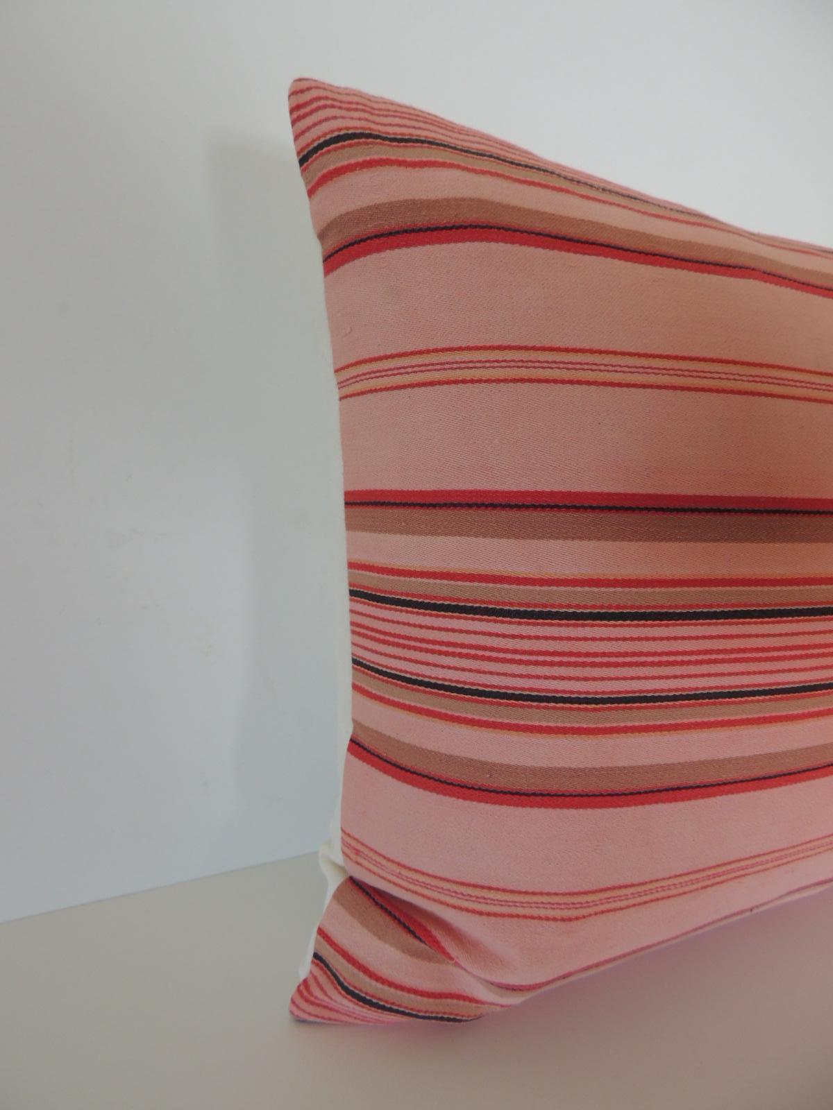 Vintage French pink and red stripes lumbar decorative pillow
French provincial linen ticking stripes lumbar decorative pillow in shades of light pink, dark pink, red, taupe, tan and natural with a natural linen backing. French provincial refers to