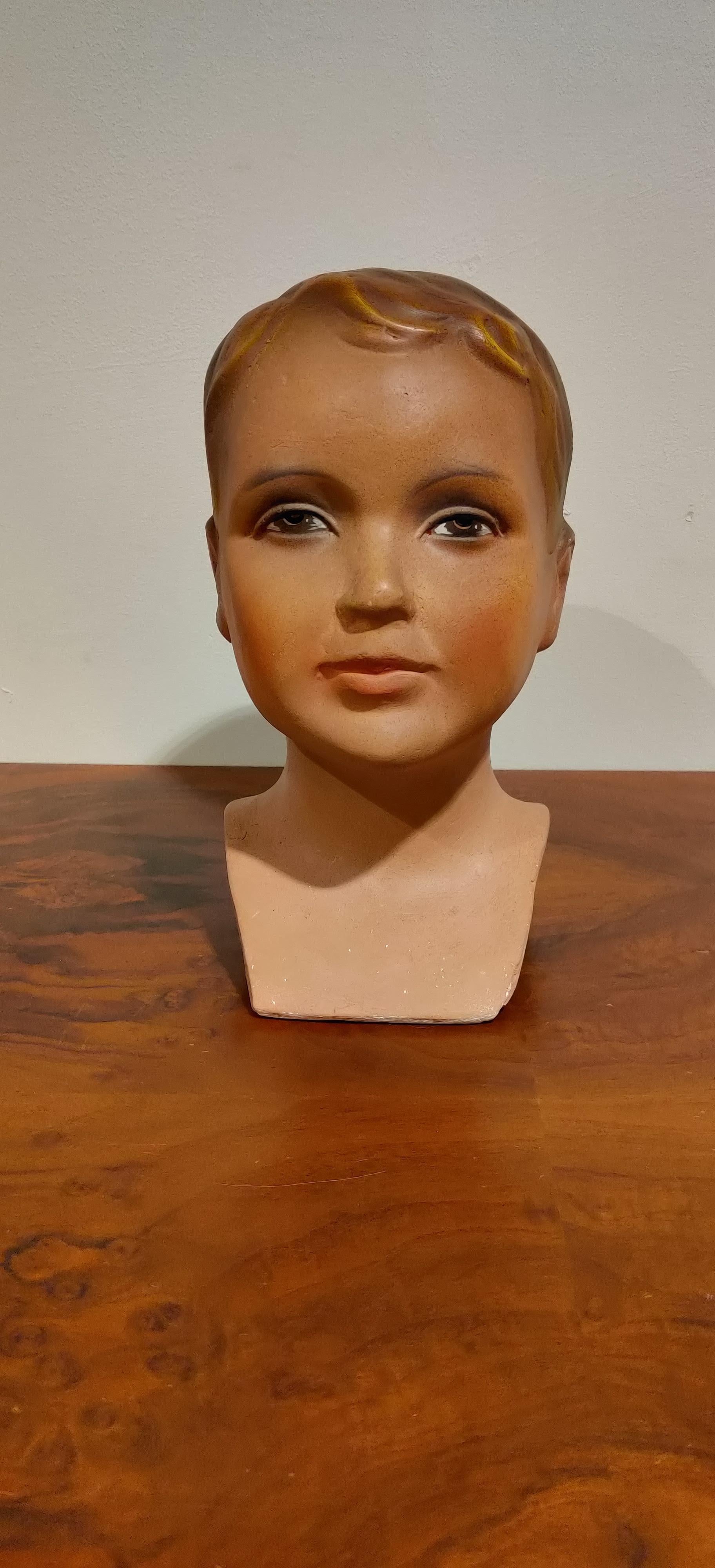 Beautiful child mannequin head made from plaster. 

It has some minor user traces.

Comes from a lot acquired from a clothes shop that stopped activities.

Great decorative item to display glasses, hats,..

France - 1960s

Measure: Height