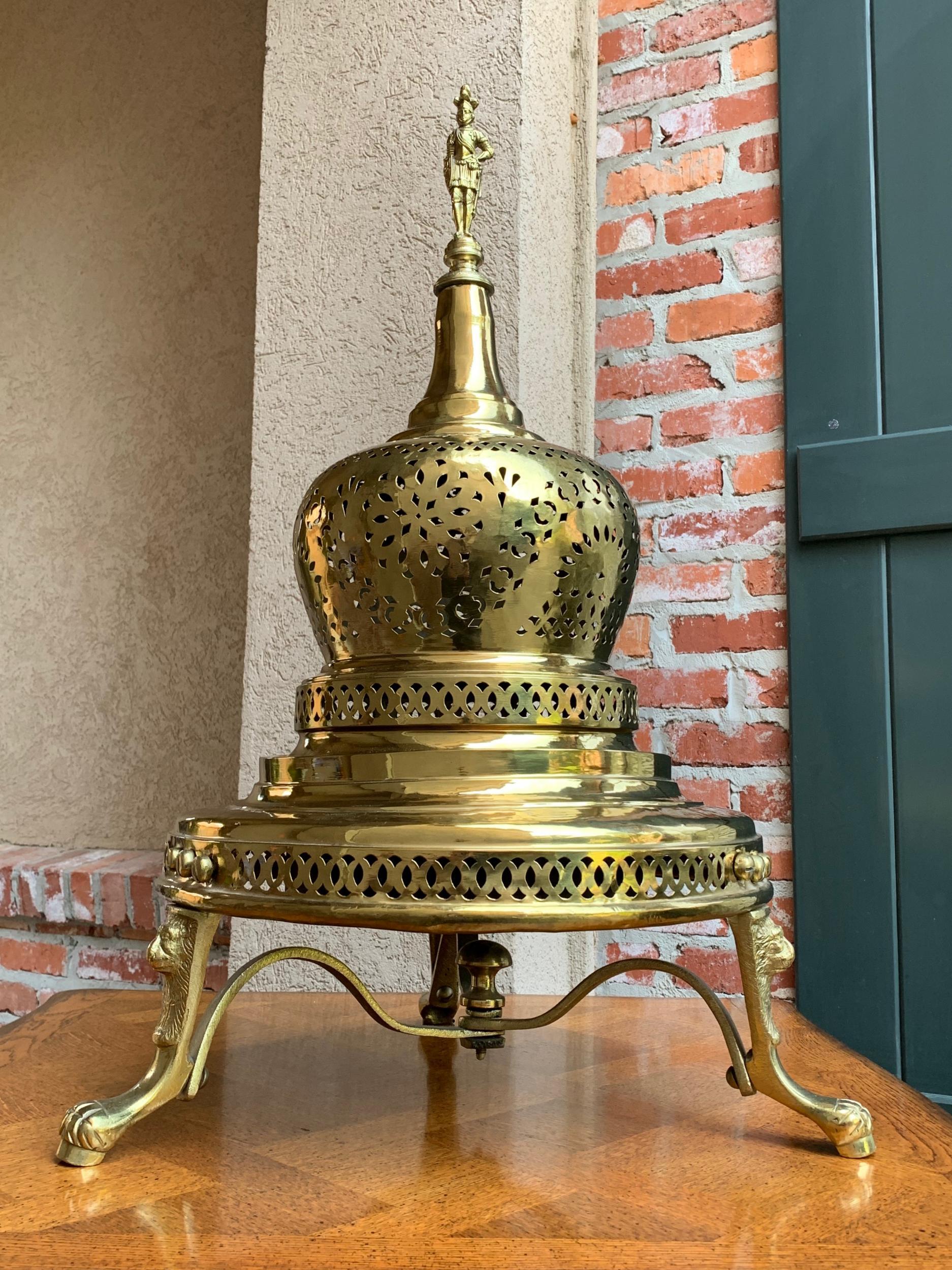 Vintage French polished brass bell brazier heater fire pit incense
 
~Direct from France~
~Gorgeously appointed French brass brazier, from the solider at the top, to the lion paw feet!~
~Very large bell shaped cover is topped with a figural solider
