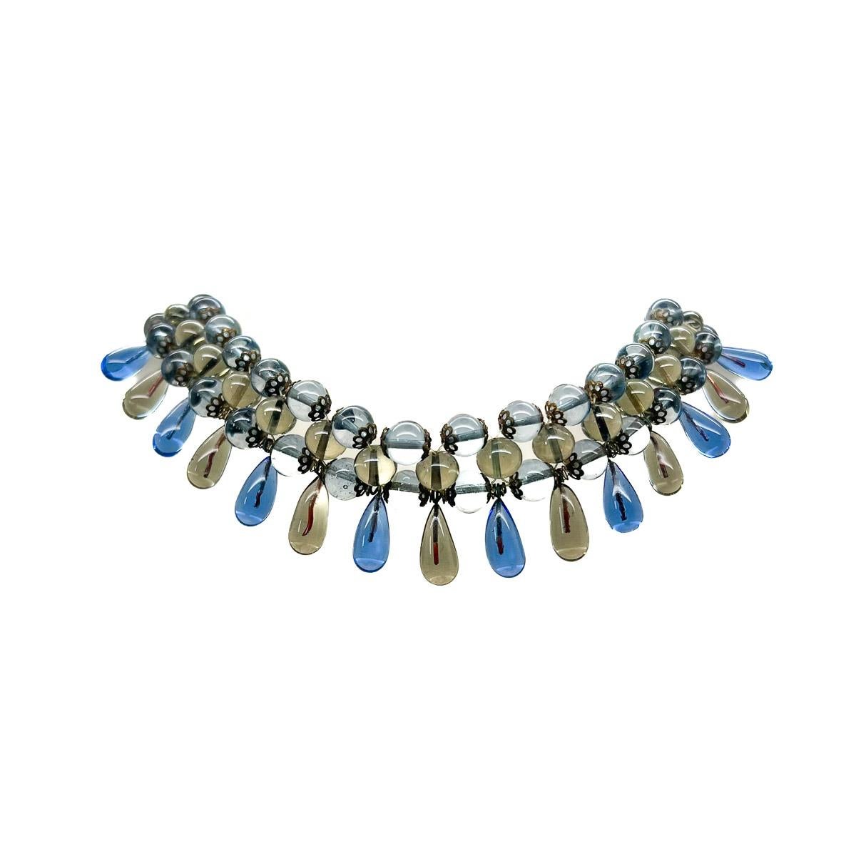 A Vintage French Poured Glass Collar. A beautiful example of French poured glass jewellery. The colours a mesmerisingly delicate blend of sapphire cornflour blue and a grey brown that proves surreally delicate and works like a dream. The artistry