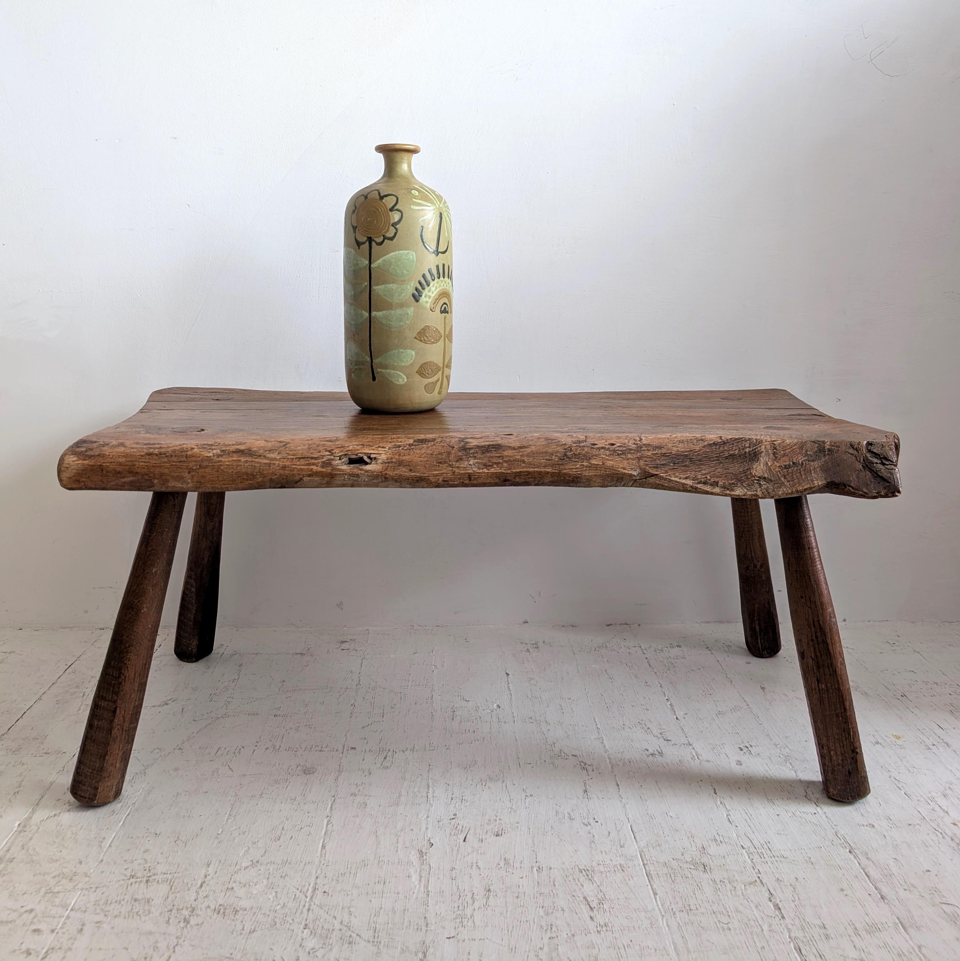 Vintage primitive coffee table carved from solid oak with a live edge, France circa 1950s 60s. 
A little bit George Nakashima, a little bit brutalist

Dimensions: width 102cm, depth 54cm, height 42cm