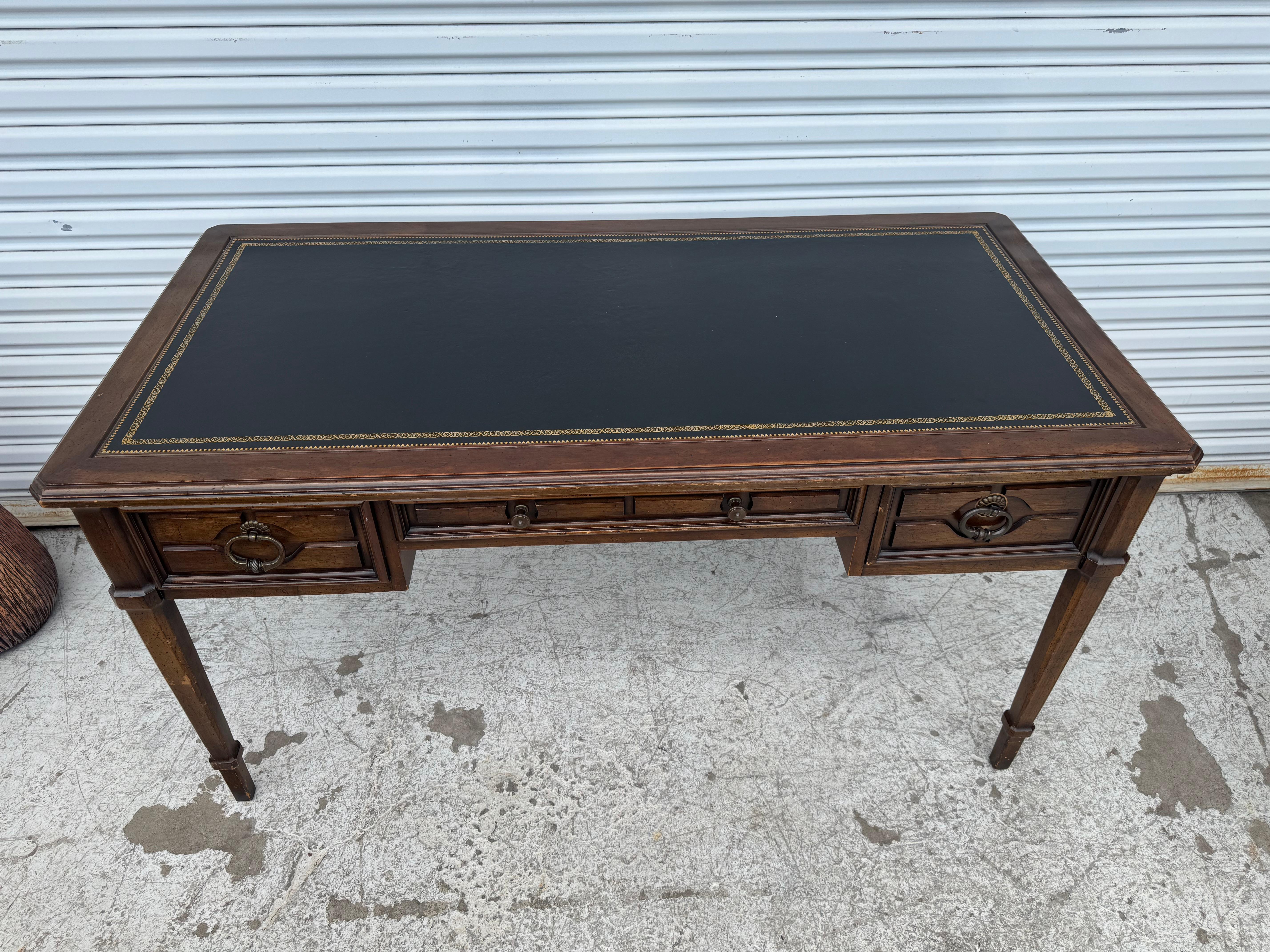 A beautiful writing desk with a leather top.
Dimensions:
Length: 56