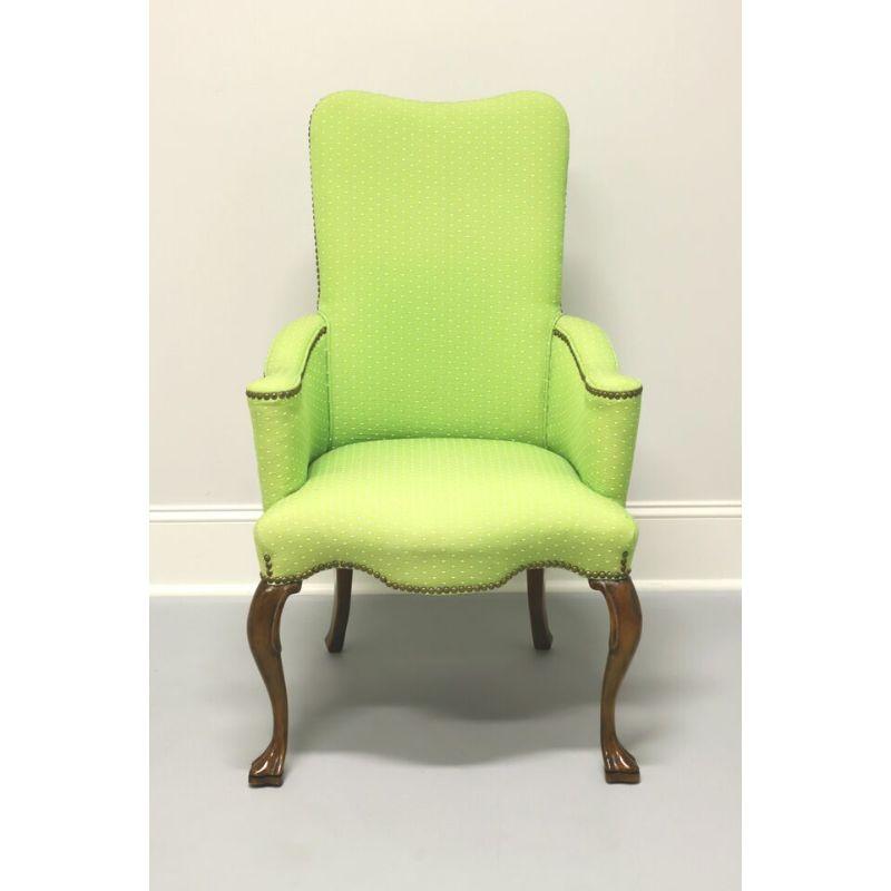 A French Provincial style accent chair, unbranded. Lime green small white polka dot fabric upholstery with nail head trim. Mahogany carved knees, cabriole legs and paw feet. Made in the USA in the late 20th Century.

Overall: 25.5 W 26 D 41.25 H,