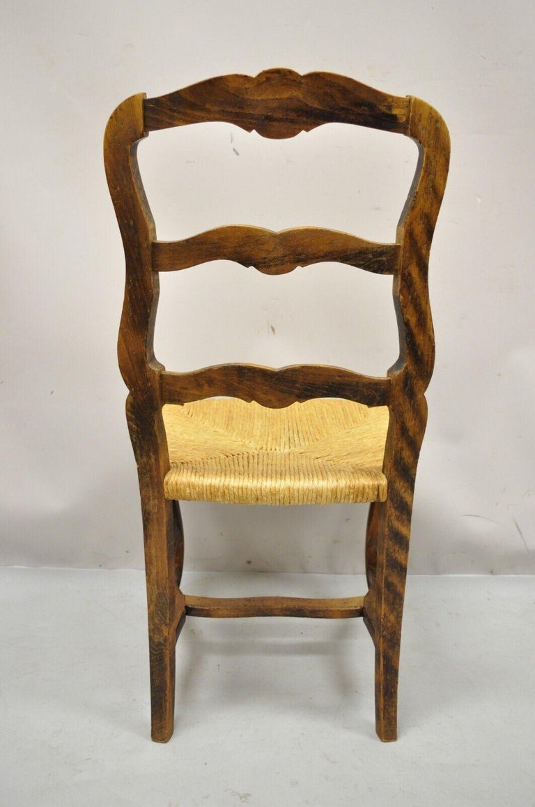 20th Century Vintage French Provincial Distressed Wood Ladder Back Rush Seat Dining Chair For Sale