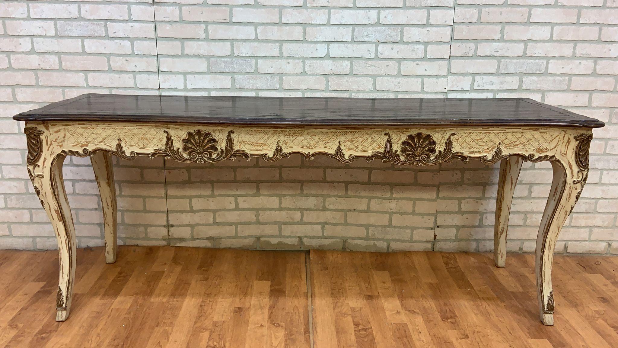 Vintage French Provincial Hand Carved Console Table with Cherry Wood Top

This exquisite French country inspired console table showcases hand-carved details and a beautifully distressed painted patina finish. Its cherry wood top adds a touch of