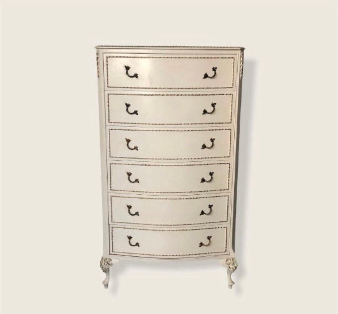 This dresser has 6-drawers with clean lines. This dresser is from a single owner home and in great condition. It includes sculpted wooden pulls, dovetailed drawers and sleek French design.