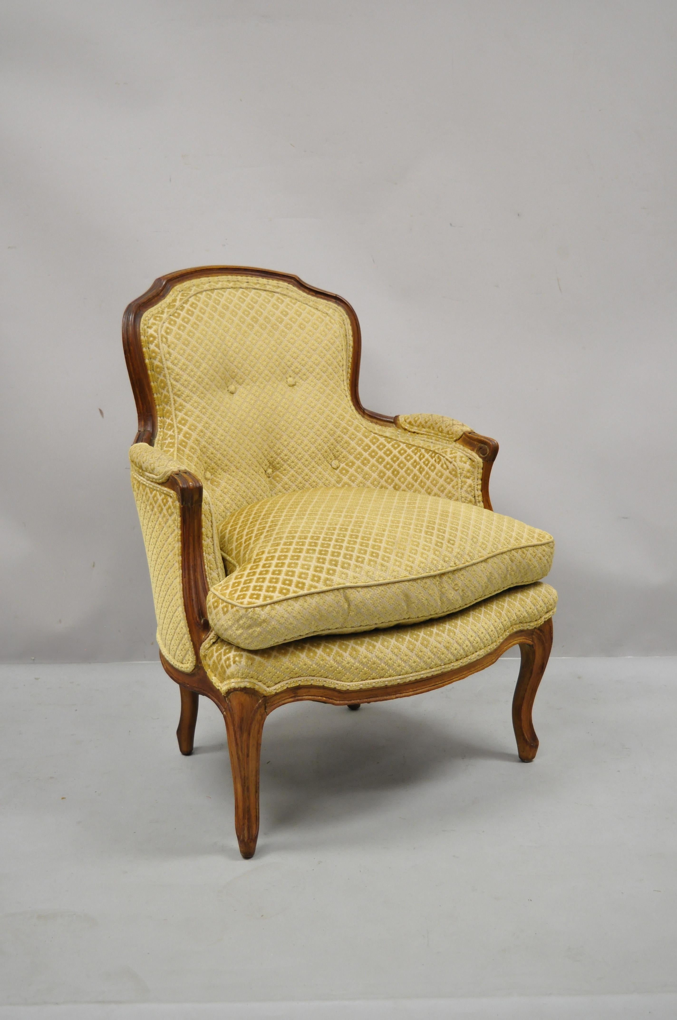 Vintage French Provincial Louis XV style small bergere walnut lounge arm chair. Item features nice smaller size, down filled cushion, solid wood frame, beautiful wood grain, nicely carved details, cabriole legs, very nice antique item, quality
