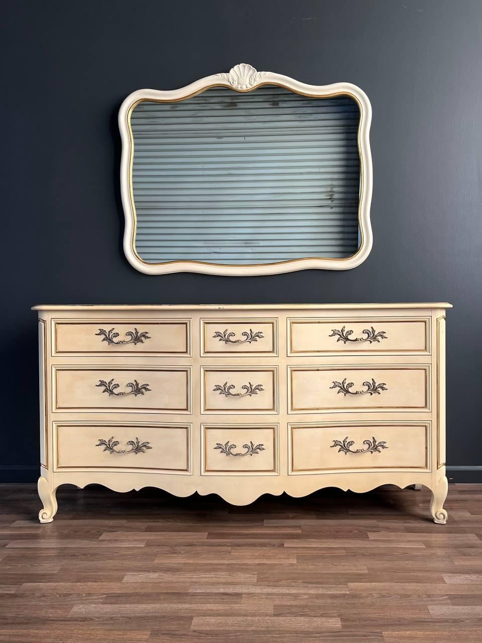 Condition: Original Vintage Condition 
Materials: Painted Wood

Dimensions: 
34.25”H x 66”W x 22”D
Mirror:
39”H x 47.50”W x 1.50”D