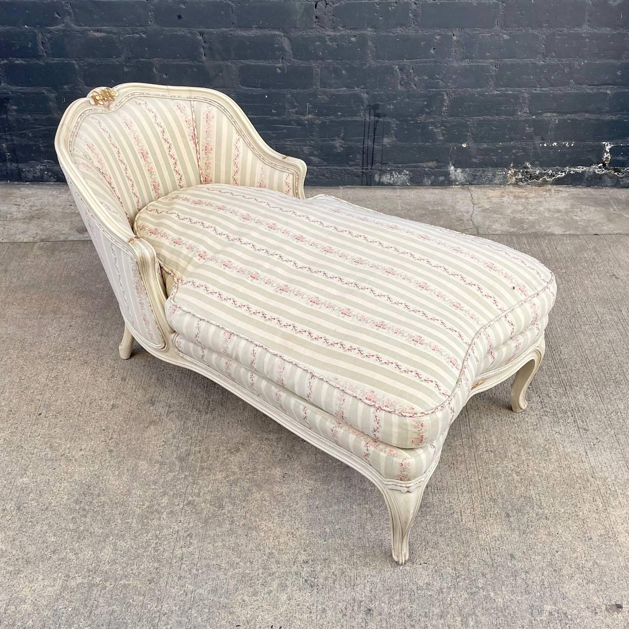 Vintage French Provincial Style Chaise Lounge Chair

Original Vintage Condition
Materials: Painted Wood, Gold Leaf, Original Upholstery
Dimensions: 
26”H x 47”W x 25.50”D
Seat Height 17”