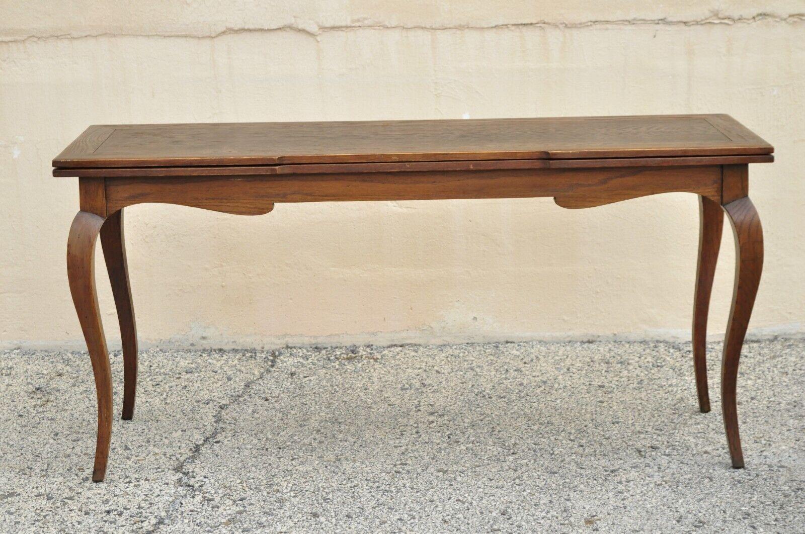 Vintage French Provincial Style Country Oak Wood Extension Console Game Table. Item features an Extension flip top, swing out butterfly legs, beautiful wood grain, cabriole legs, very nice vintage item, great style and form, maker unconfirmed,
