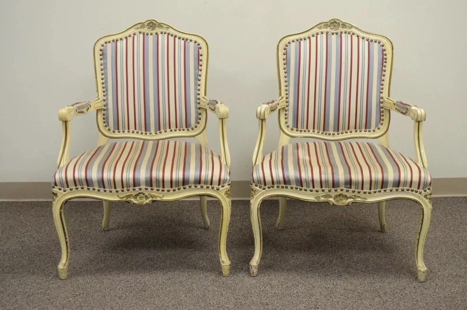 Vintage French Provincial Style Cream Painted Dining Room Chairs - Set of 6. Item features 4 side chairs, 2 armchairs, solid wood frames, cabriole legs, upholstered back and seats, distressed cream painted finish. Circa Mid 20th Century.