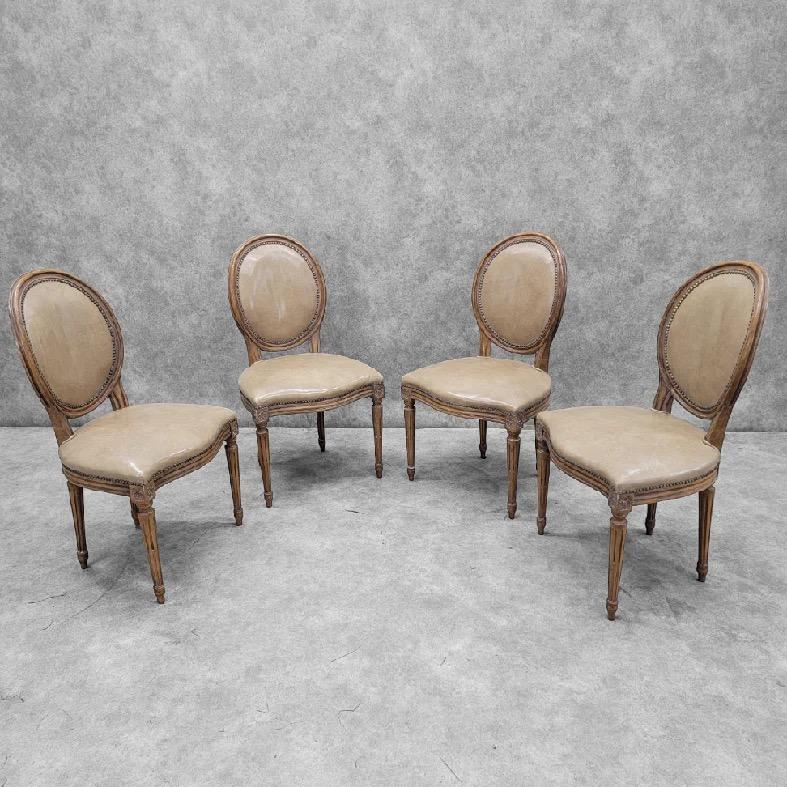 Vintage French Provincial Style Medallion Back Chairs By Baker Furniture Co. in Beige Leather - Set of 4 

This set of four Vintage French Provincial Style Medallion Back Chairs by Baker Furniture Co. showcases timeless elegance and craftsmanship.