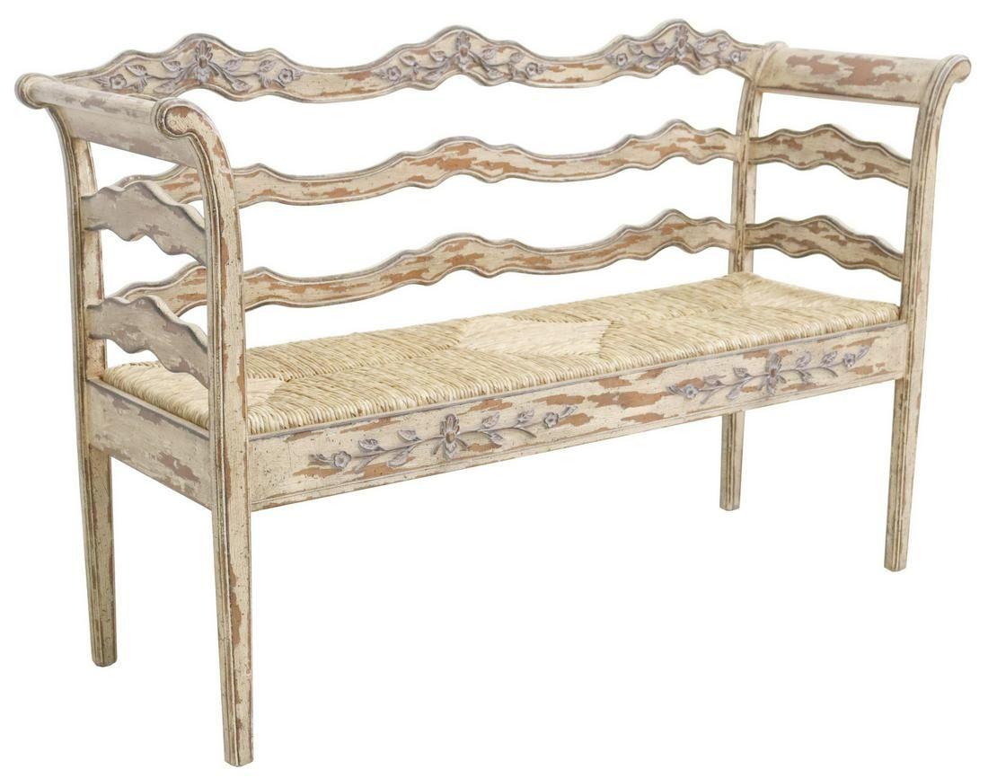 Contemporary French provincial style paint-decorated bench, having scalloped horizontal slat back, with foliate accents, rolled side rails, all in intentionally distressed finish, over rush seat, rising on tapered legs.

Dimensions
approx 38.5