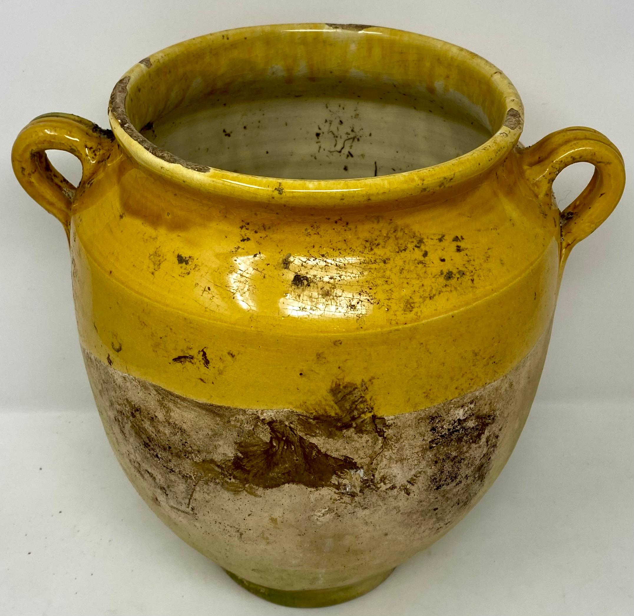 Vintage hand-made French Provincial yellow terracotta glazed confit pottery jar with handles.
Per the last photo we have a few of these in various sizes and shapes. Each has the normal amount of wear and tear from years of use.
The one photographed