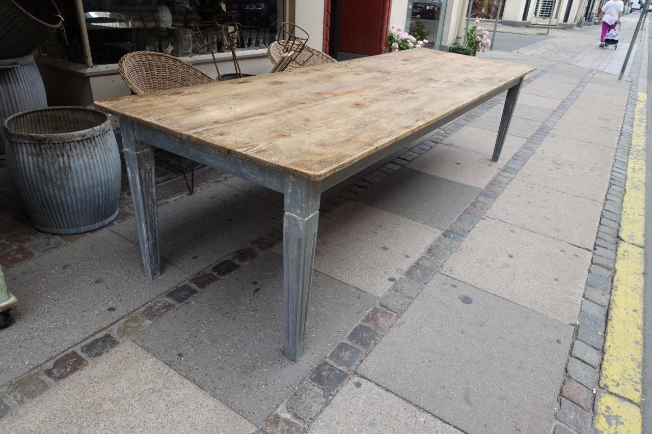 Handsome vintage French long refectory table, from circa 1900. Wood, gorgeous raw pale wood patina. The table surface is constructed of wide planks, which play nicely with the lovely pale grey painted tapered and grooved legs.