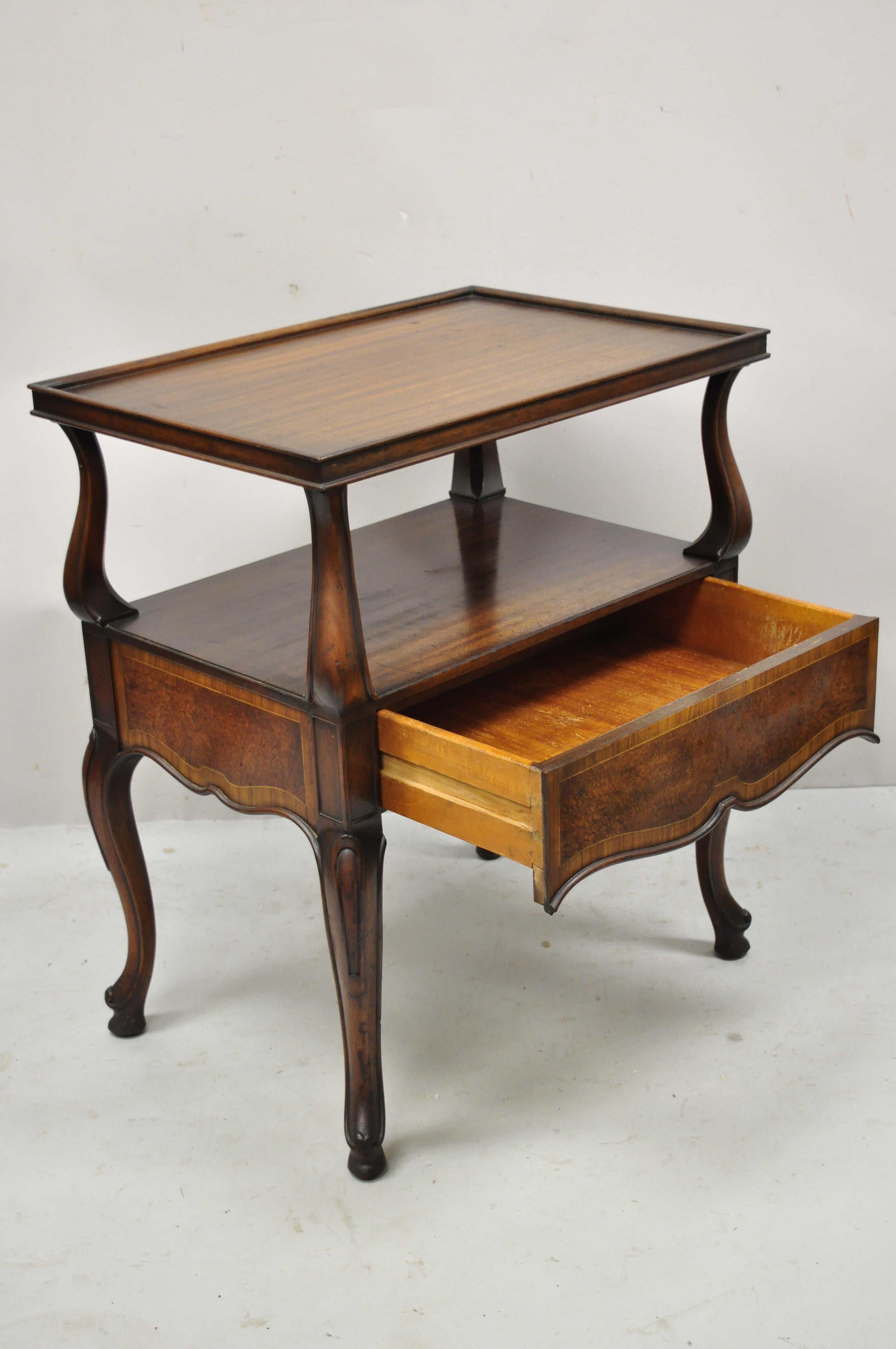 Vintage French Regency banded walnut one drawer lamp table end side table. Item features banded front and sides, beautiful wood grain, finished back, 1 dovetailed drawer, cabriole legs, very nice vintage item, great style and form. Circa Early to