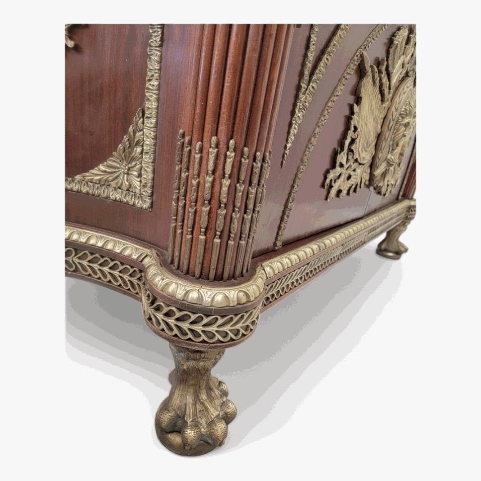 Vintage French Regency Style Brass Ormolu Mounted Marble Top Sideboard/Cabinet - Pair

Spectacular mahogany French Regency style chest commode with a beveled marble table top. This piece is embellished with an elaborate bronze ormolu trim in a Roman