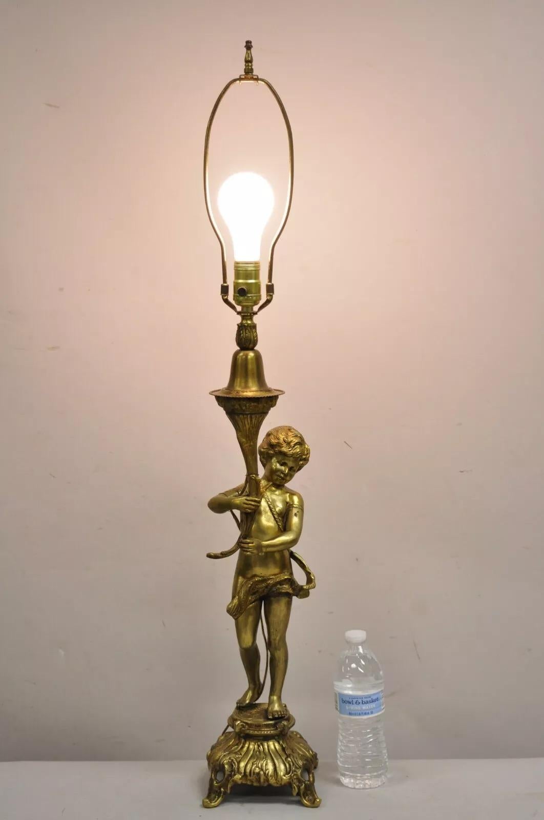 Vintage French Renaissance Brass Rococo Gold Figural Cherub Putti Table Lamp. Circa Mid 20th Century. Measurements: 37.5