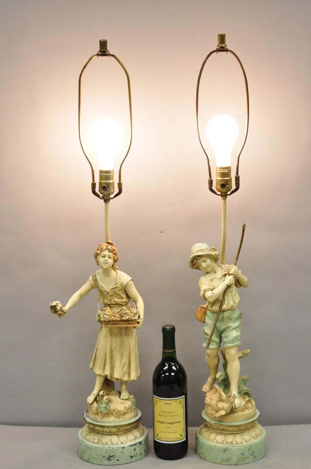 Vintage Renaissance Moreau Metal Boy and Girl Blue & White Shabby Chic Distress Painted Figural Table Lamps - a Pair. Circa Early 20th Century. Dimensions : 36