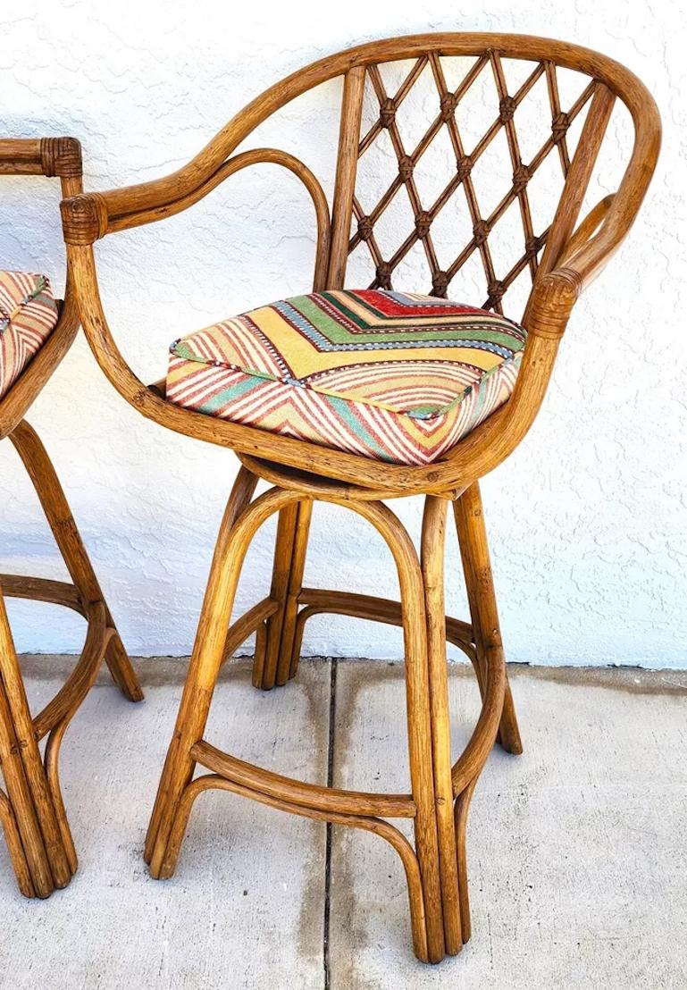 For FULL item description click on CONTINUE READING at the bottom of this page.

Offering One Of Our Recent Palm Beach Estate Fine Furniture Acquisitions Of A
Set of 3 Vintage French Retro Style Bamboo Rattan Barstools with Full 360 Swivel
