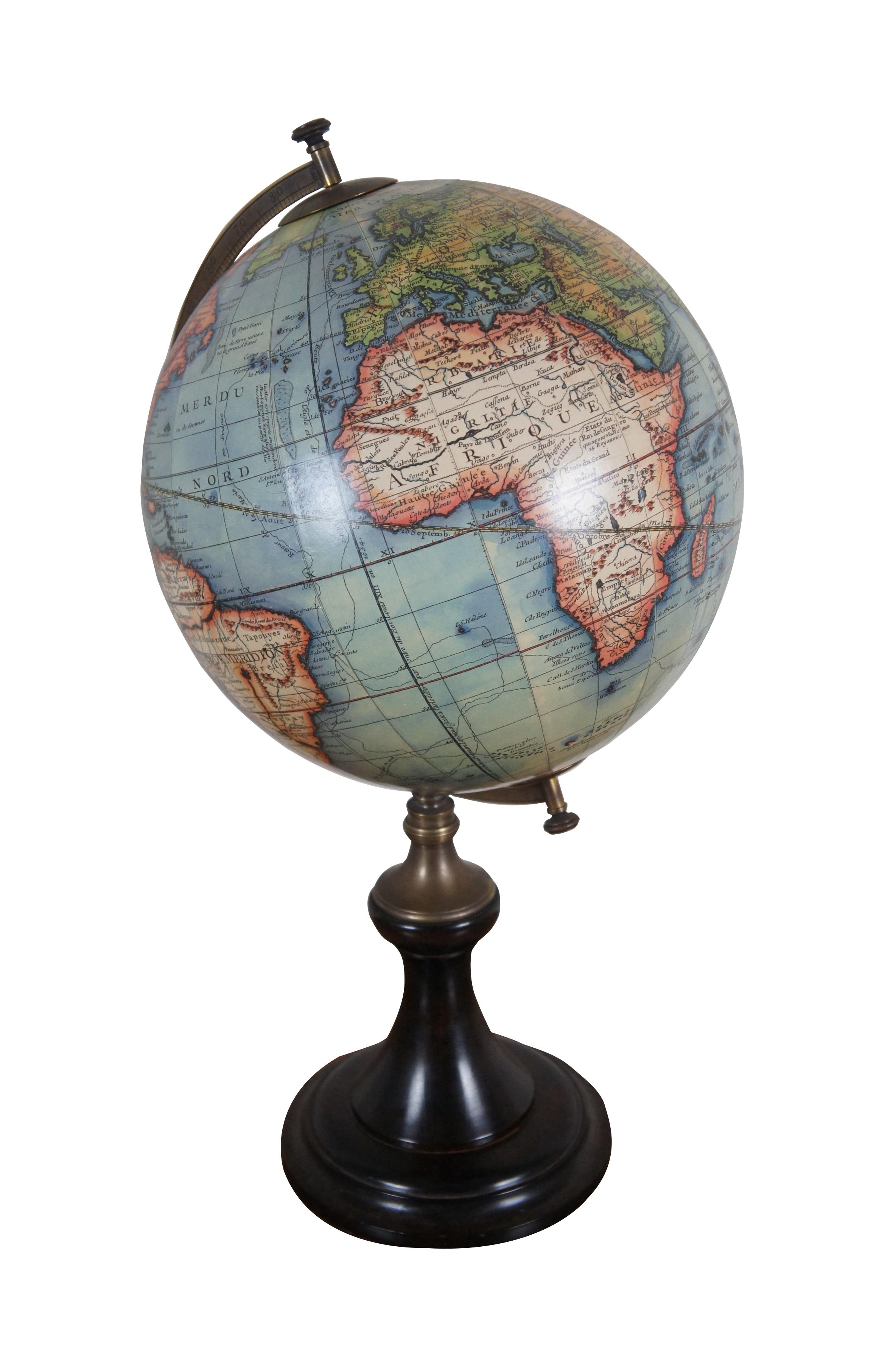Late 20th century tabletop library globe with an elegant turned wood base and antique brass meridian. Globe is modeled on a 1745 edition by Gilles and Didier Robert De Vaugondy. Produced by AM India.  Terrestrial Globe, A Paris.

