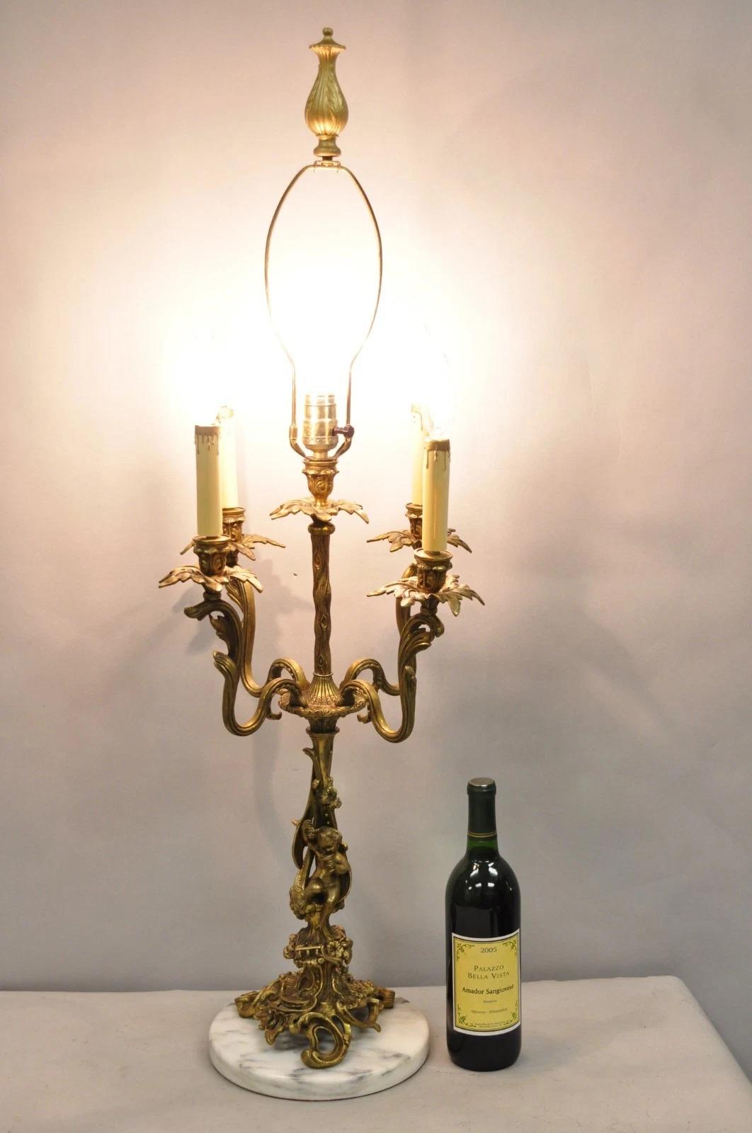 Vintage French Rococo Louis XV Style Brass and Marble Figural Cherub Candelabra Table Lamp. Circa Mid 20th Century. Dimensions : 40