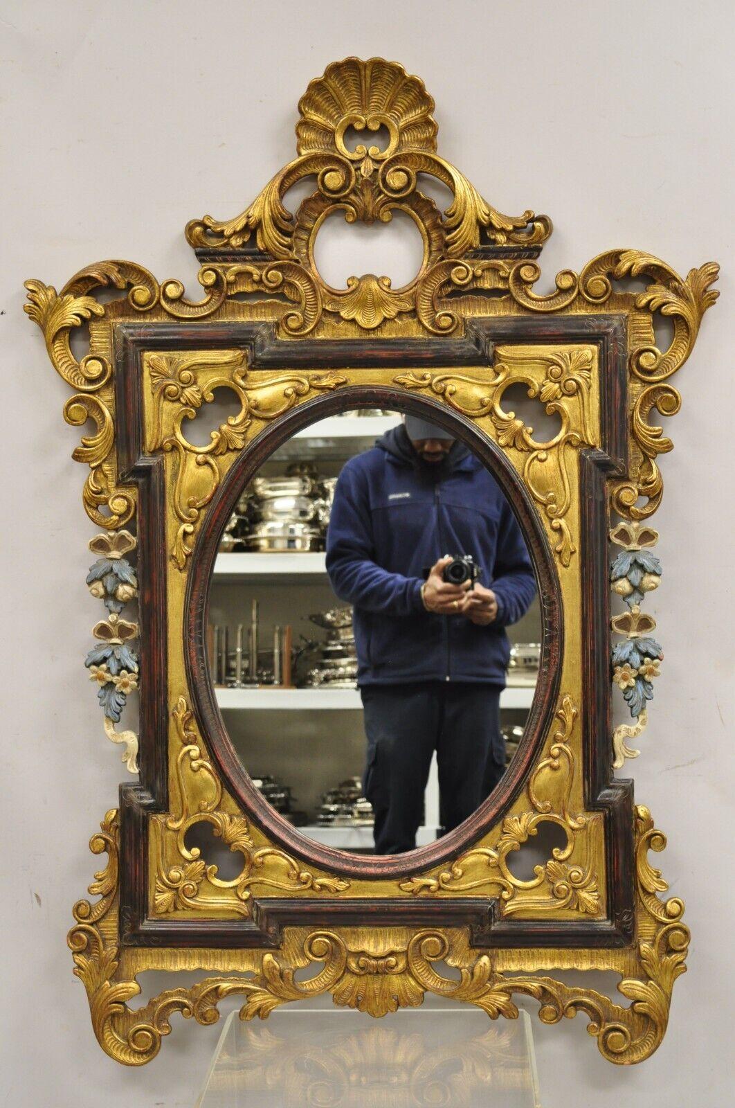 Vintage French Rococo Style Gold Gilt Scroll Carved Wood Italian Wall Mirror. Item features  Blue and white painted floral carvings, nicely carved wooden frame, distressed finish, very nice vintage mirror. Circa Mid to Late 20th Century.