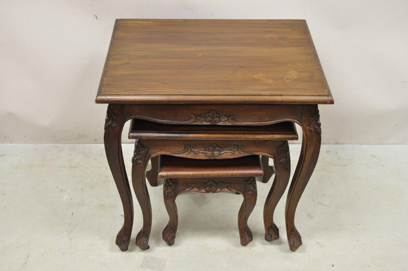 Vintage French Rococo Style Mahogany Nesting Side Tables - Set of 3. Item features 3 nesting tables, solid wood construction, beautiful wood grain, nicely carved details, cabriole legs, very nice vintage set. Circa Late 20th Century.
Measurements: